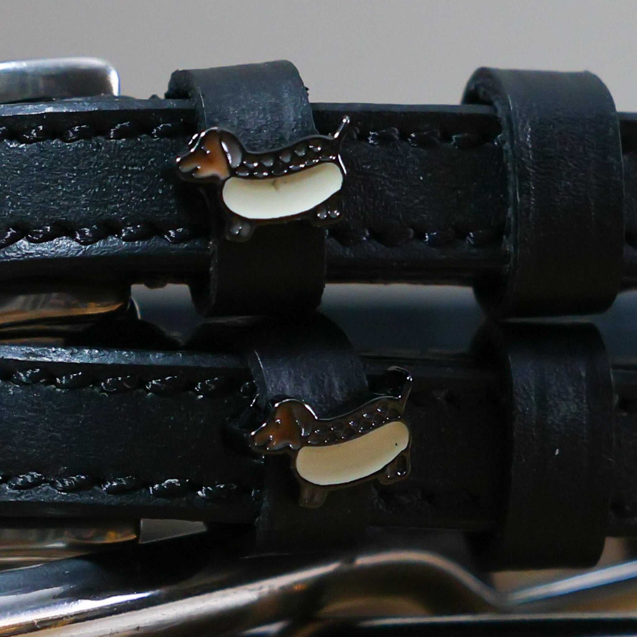 Black leather Hot Dog Spur Straps with stainless steel buckles and custom dachshund charm