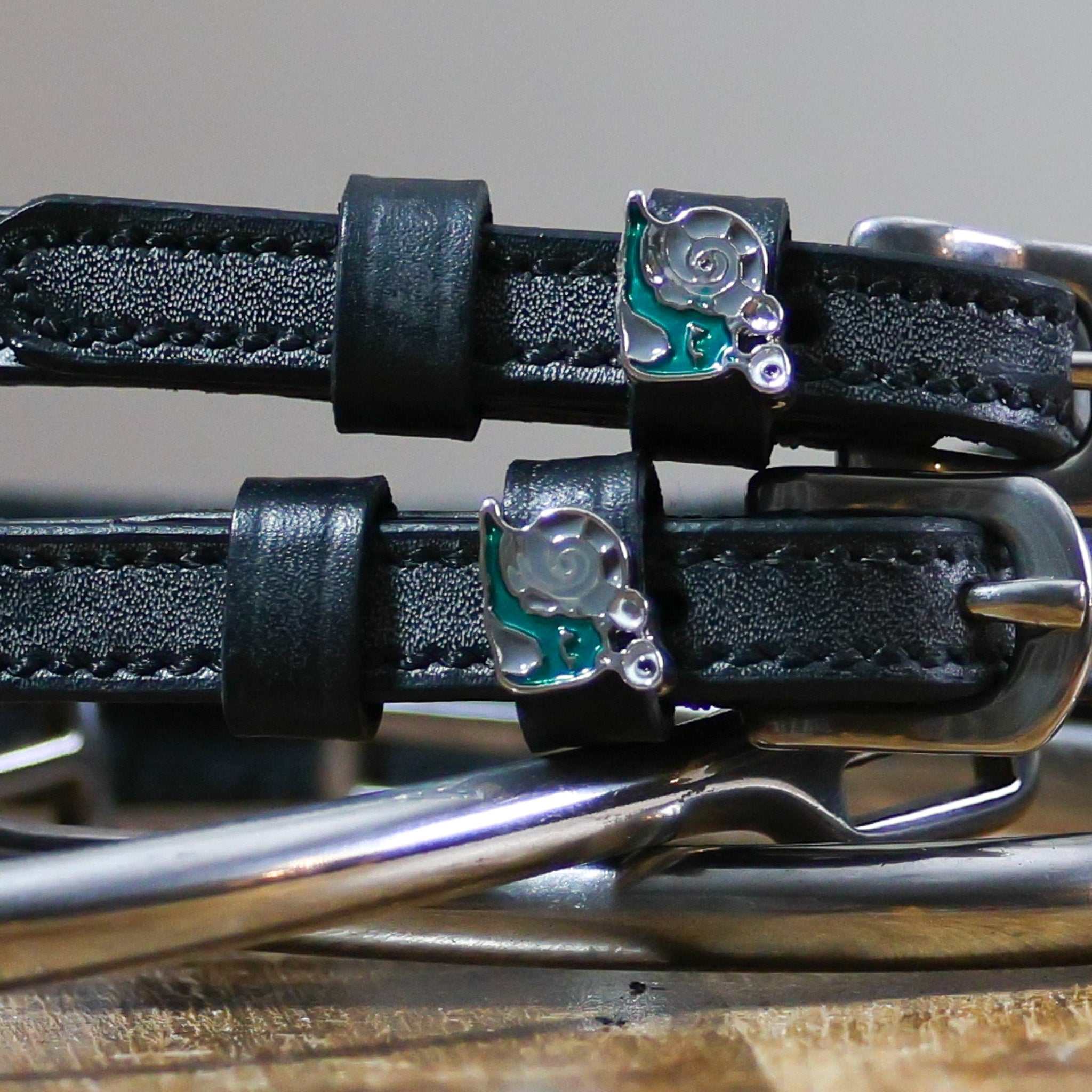 Black leather Snail Spur Straps with stainless steel buckle and custom snail charm