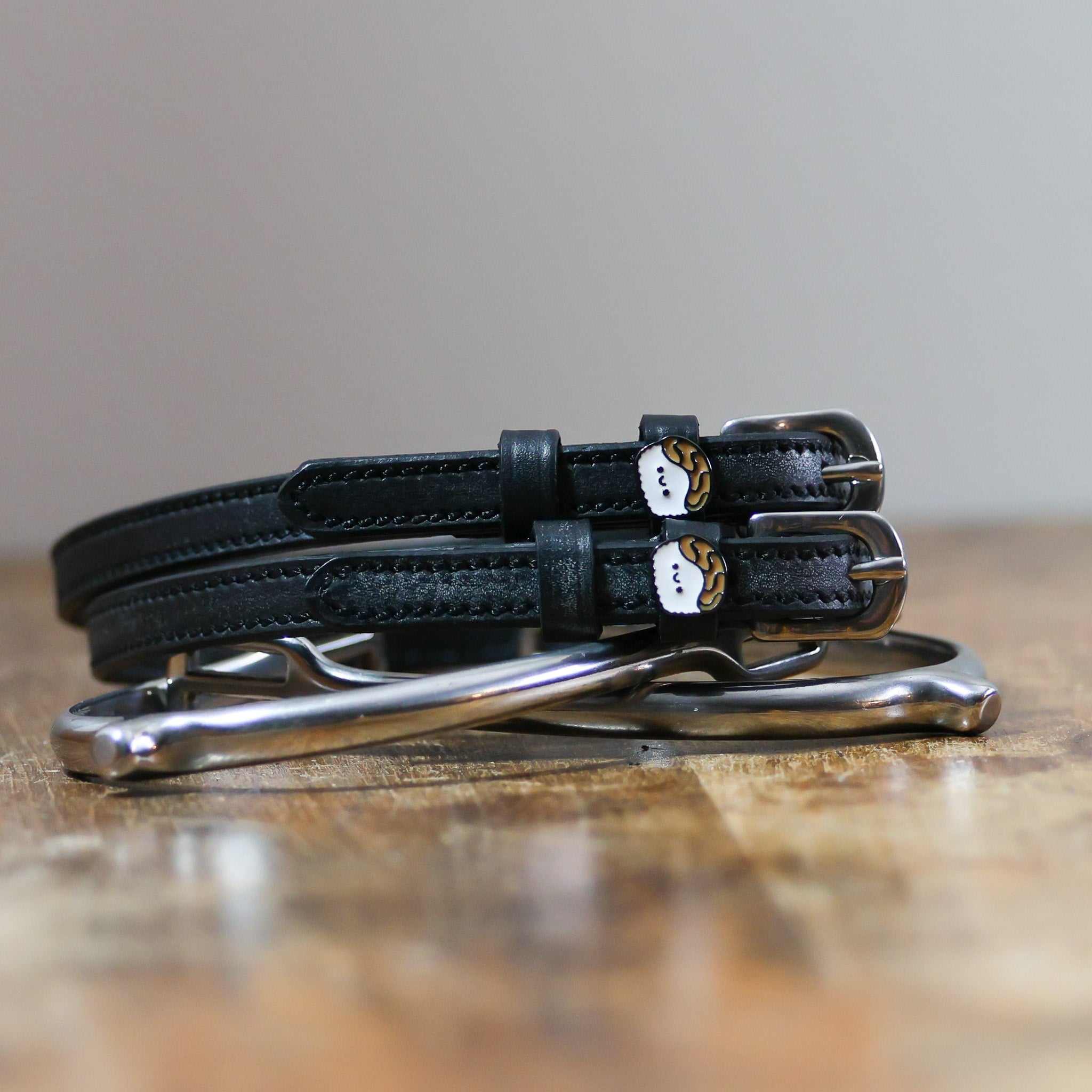ManeJane Sushi Spur Straps Spur Straps — black leather, non-stretch, hero image for English riders.