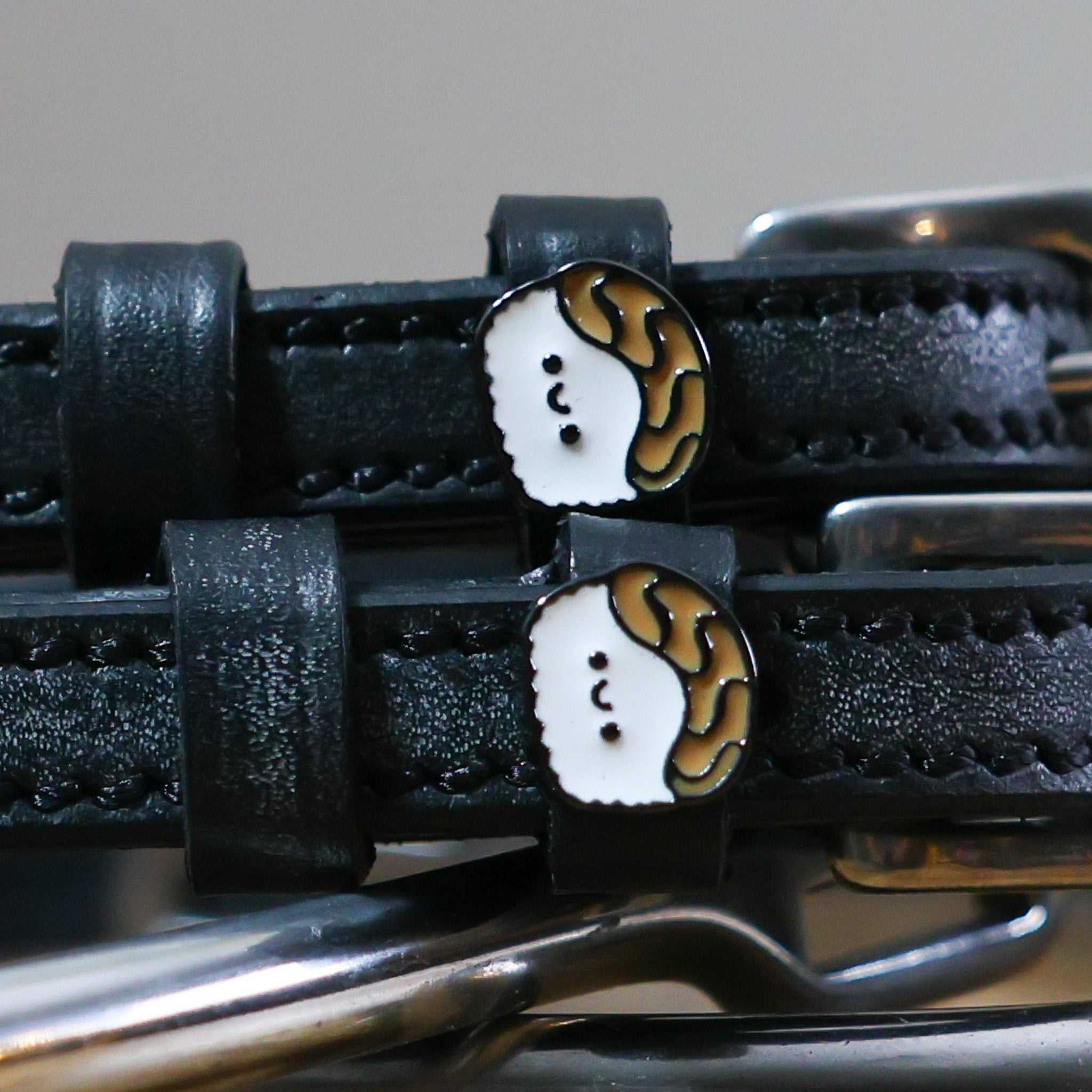 Black leather Sushi Spur Straps with sushi-shaped custom charm and stainless steel buckles