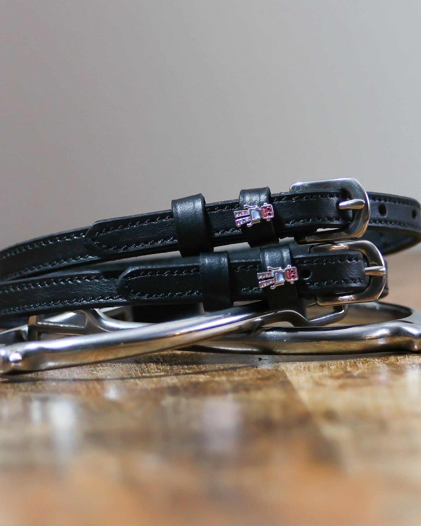 ManeJane Robot Spur Straps Spur Straps — black leather, non-stretch, hero image for English riders.