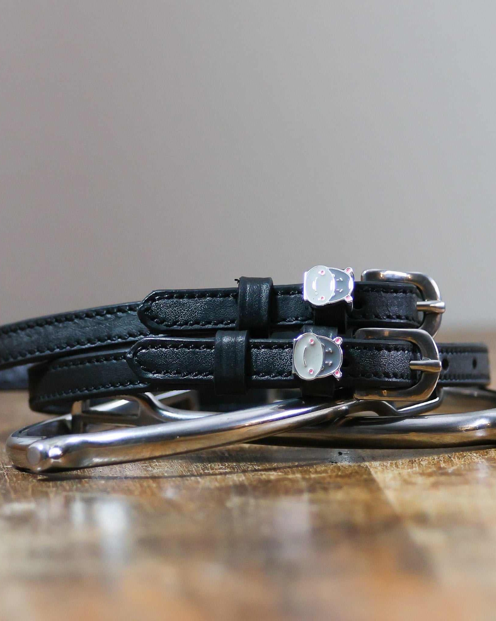 ManeJane Hippo Face Spur Straps Spur Straps — black leather, non-stretch, hero image for English riders.