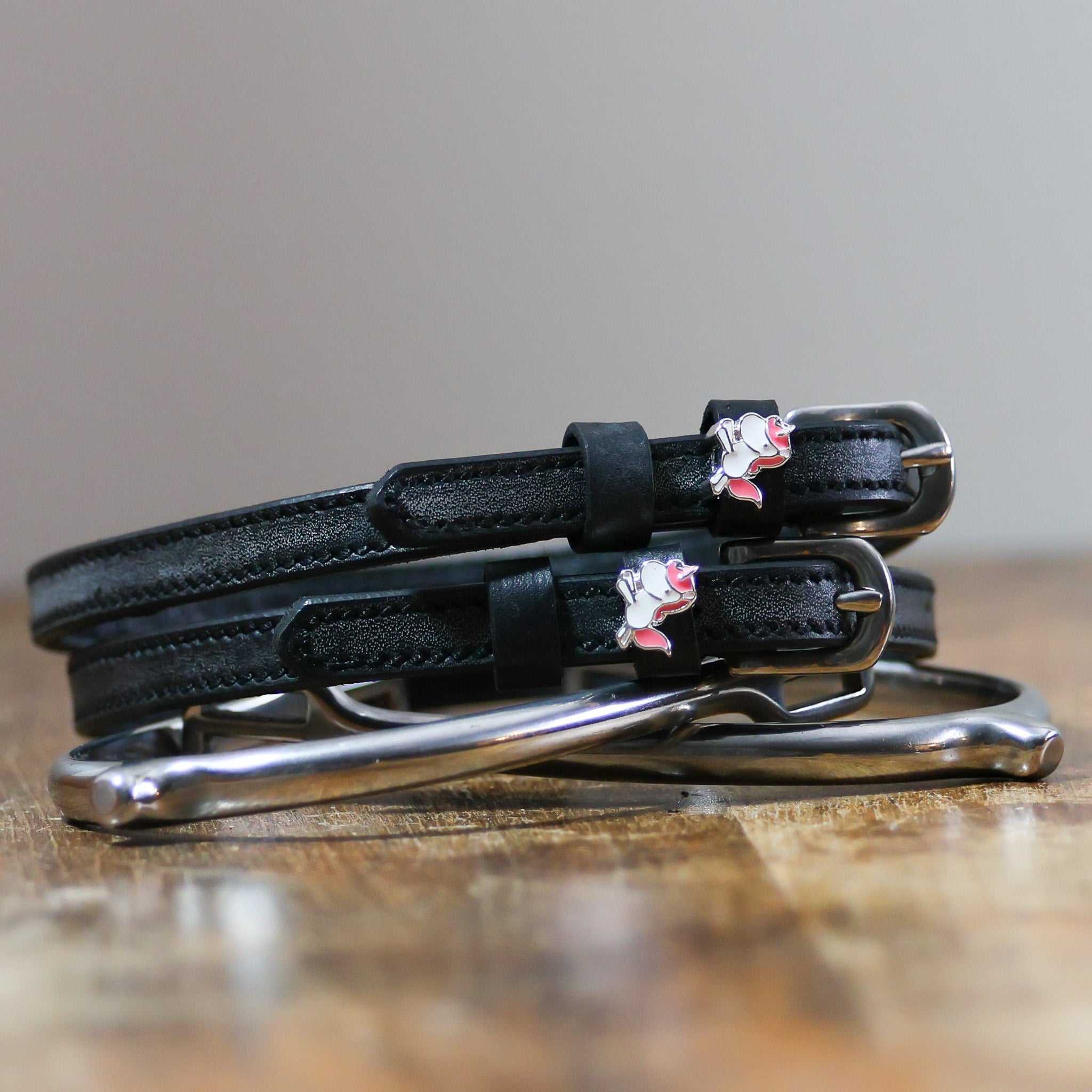 ManeJane Phat Unicorn Spur Straps Spur Straps — black leather, non-stretch, hero image for English riders.