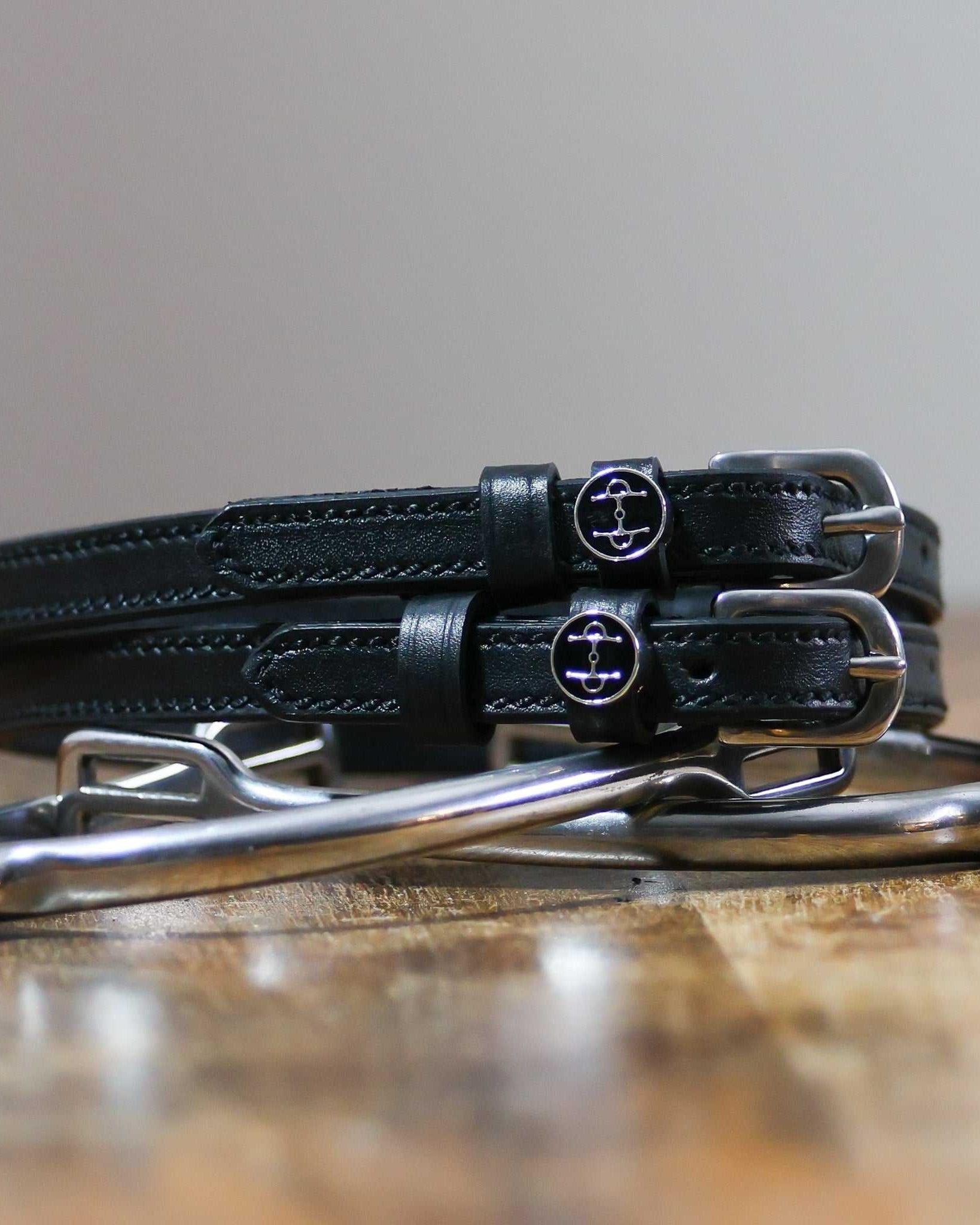ManeJane Full Cheek Spur Straps Spur Straps — black leather, non-stretch, hero image for English riders.