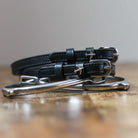 ManeJane Plane Spur Straps Spur Straps — black leather, non-stretch, hero image for English riders.