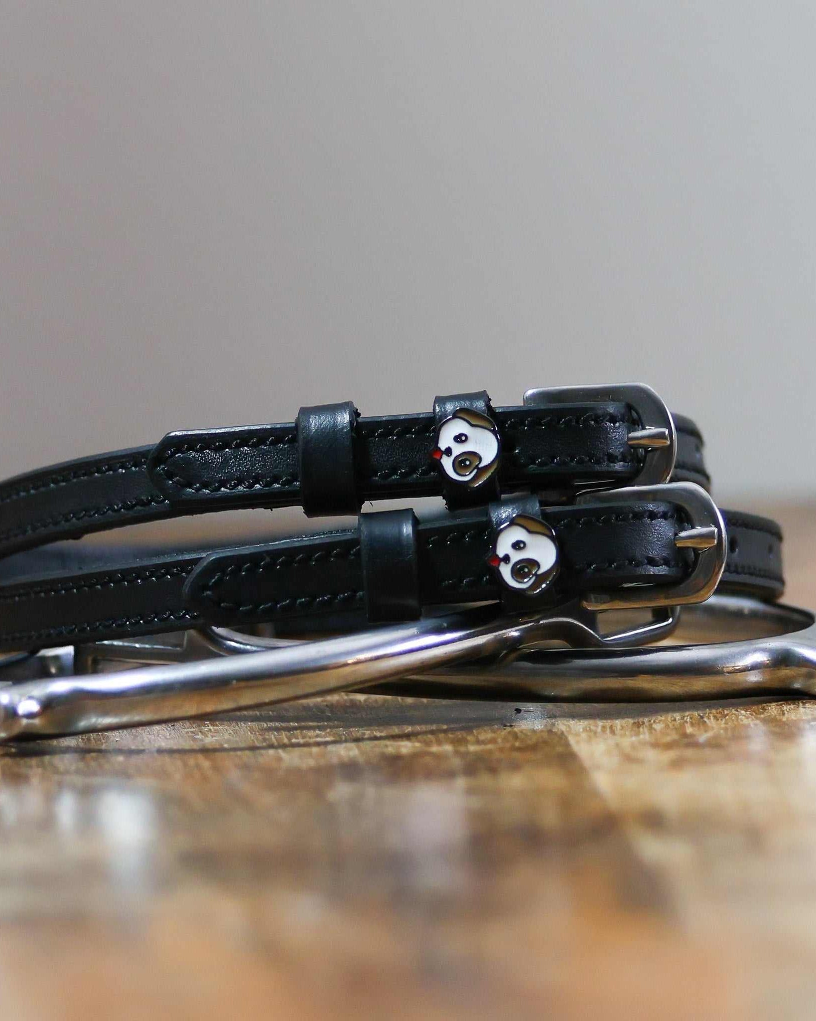 ManeJane Dog - Puppy Spur Straps Spur Straps — black leather, non-stretch, hero image for English riders.