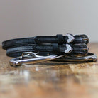 ManeJane Gray Horse Spur Straps Spur Straps — black leather, non-stretch, hero image for English riders.