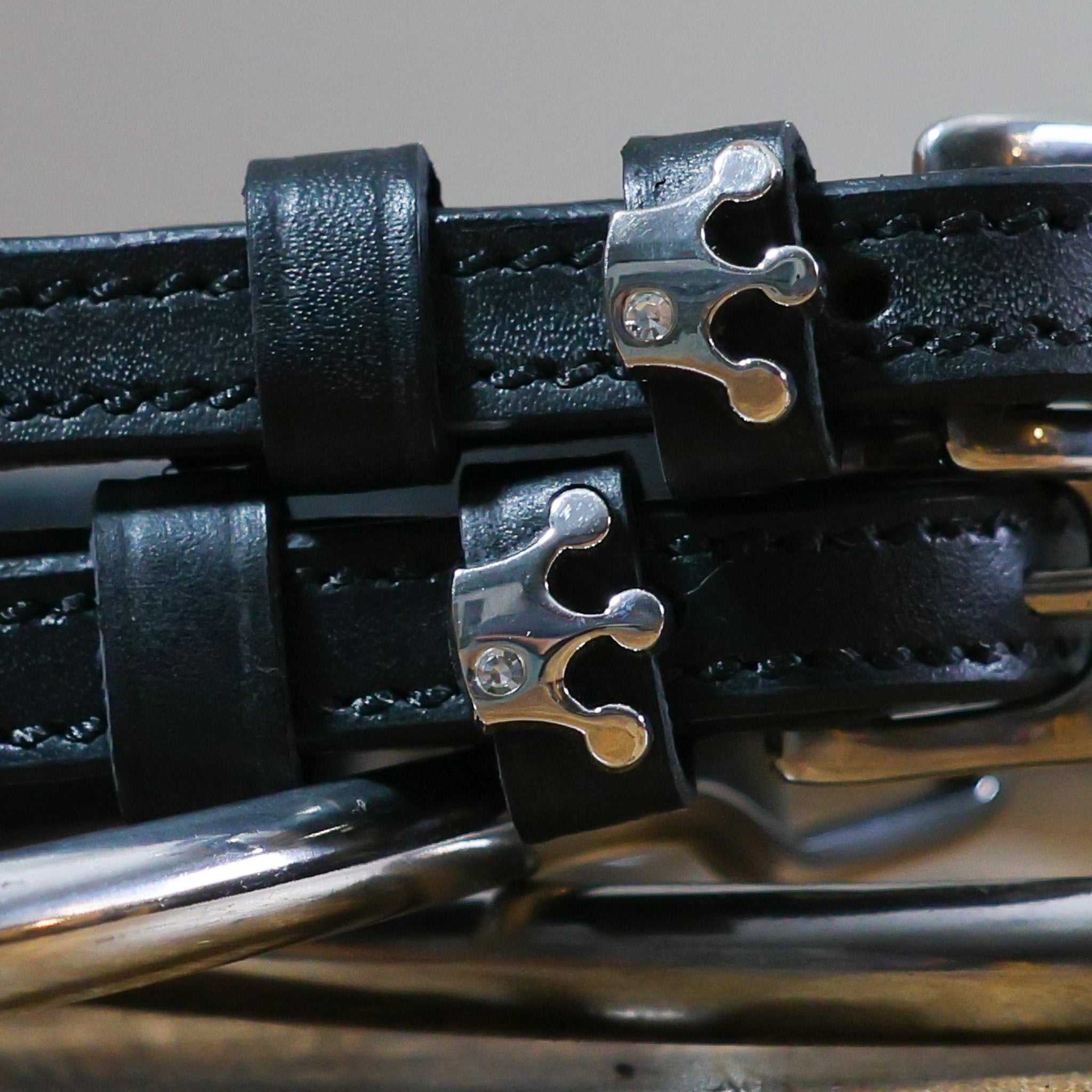 Black leather Queenie Spur Straps with stainless steel crown buckle and custom charm