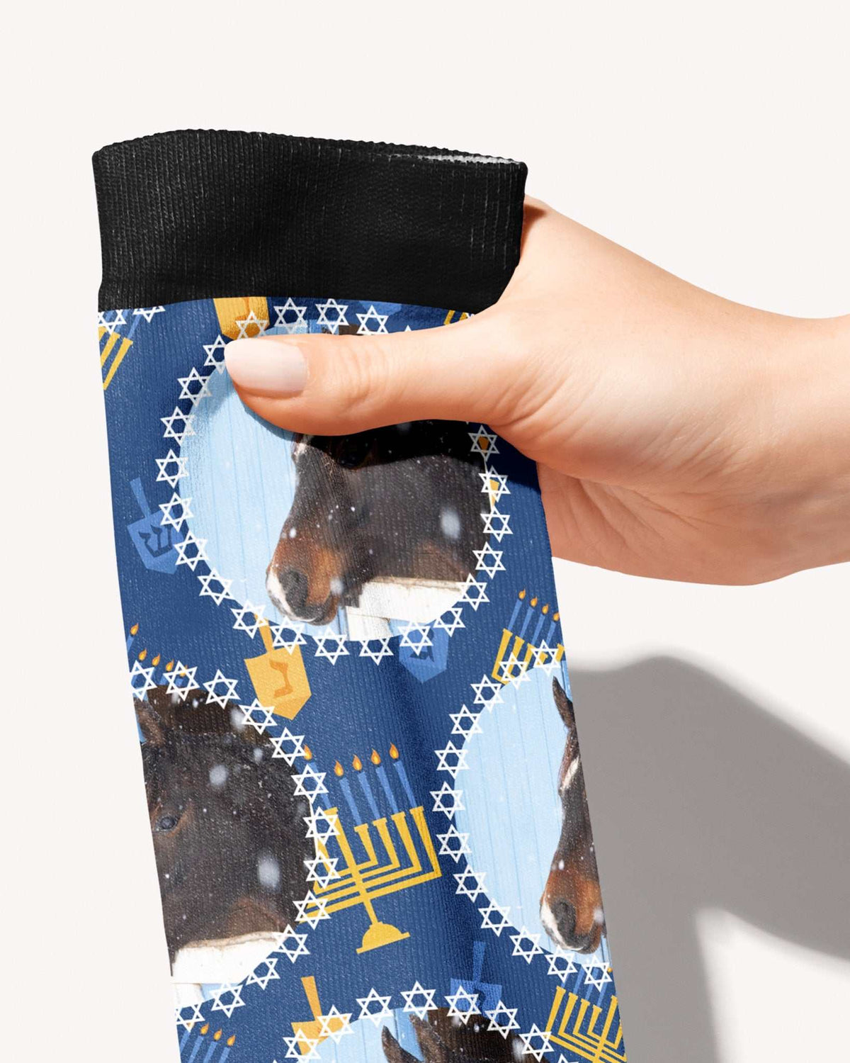 Oy to the World custom photo equestrian boot socks, held in hand, close-up of the Star of David frame pattern, by Dreamers & Schemers