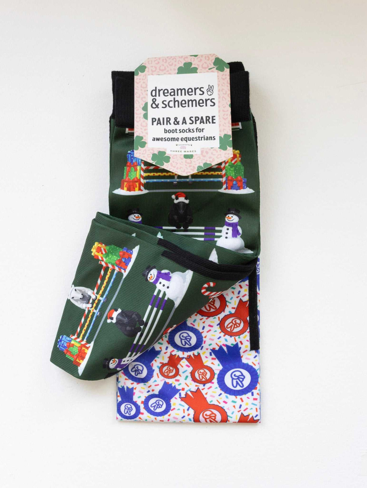 Jump for Joy youth boot socks shown folded with the included spare sock and patterned cuff