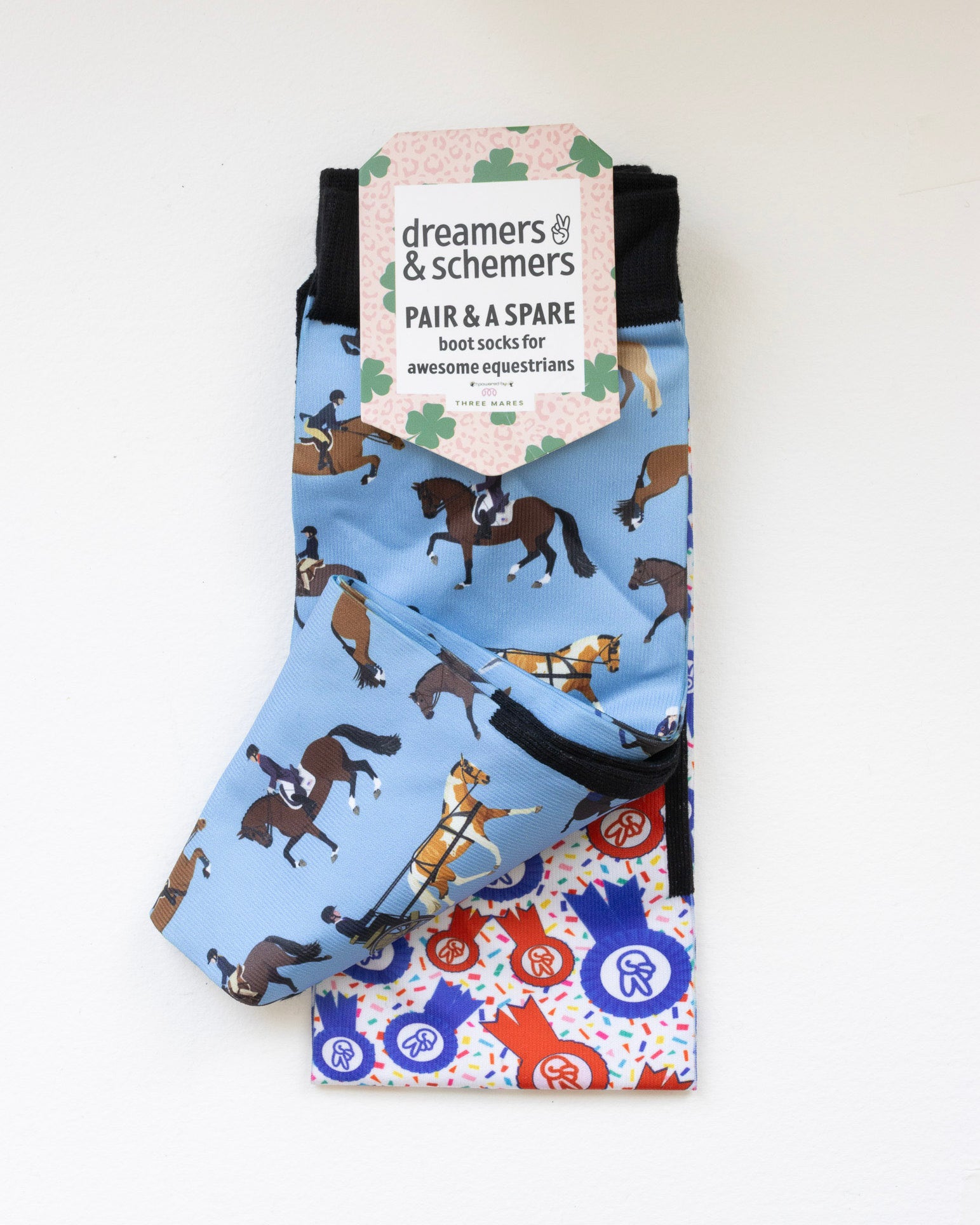 The Pony Island Horse Sports boot socks shown folded with the included spare sock and printed cuff detail