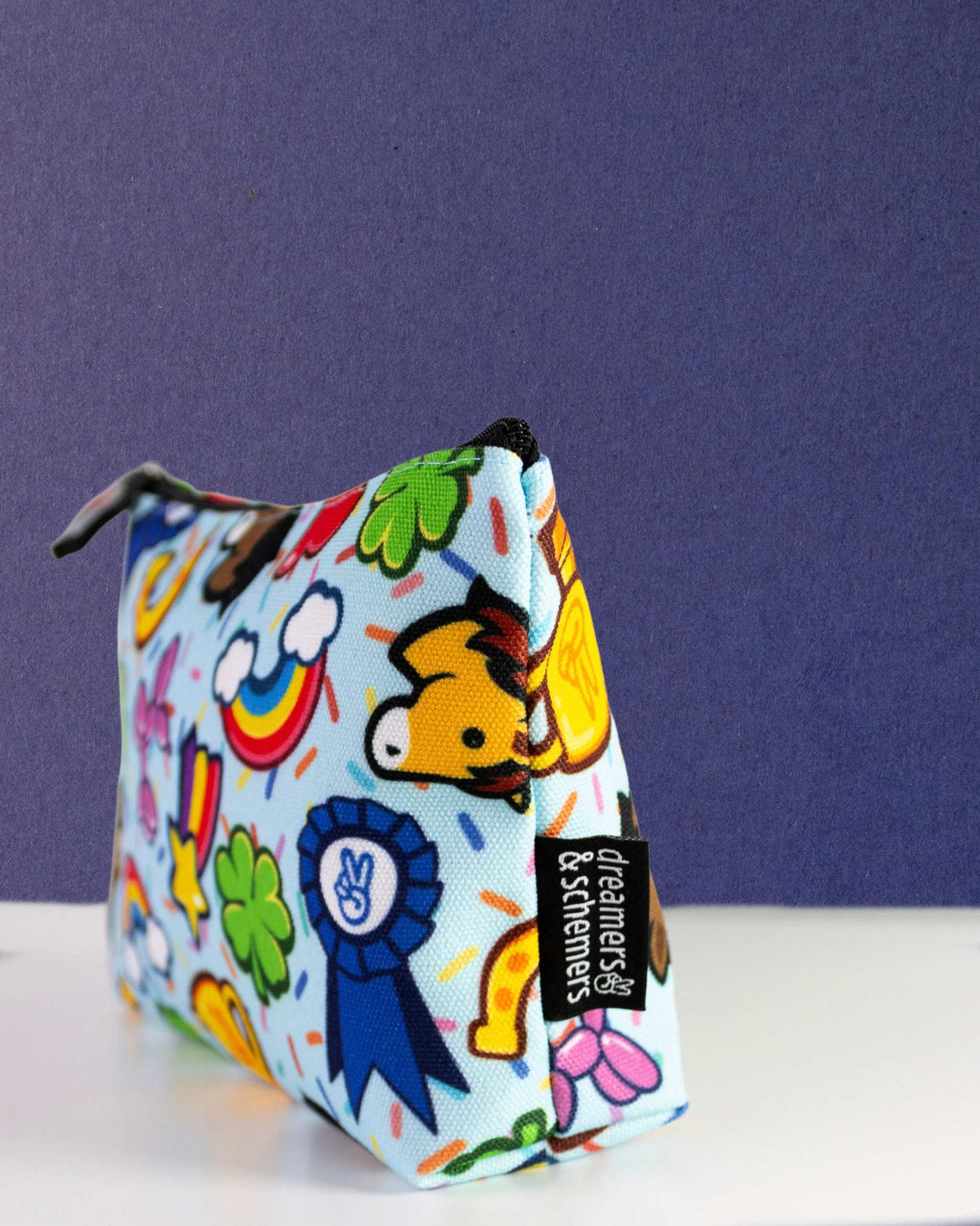 Lucky Charm pouch standing on its own gusset, self-standing, a blue prize ribbon on the side panel