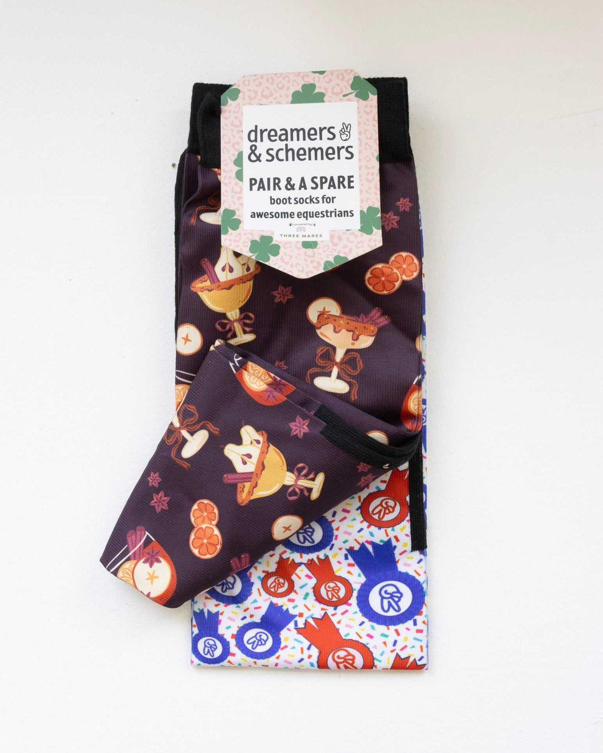 Stir Crazy boot socks shown folded with the included spare sock and printed cuff detail