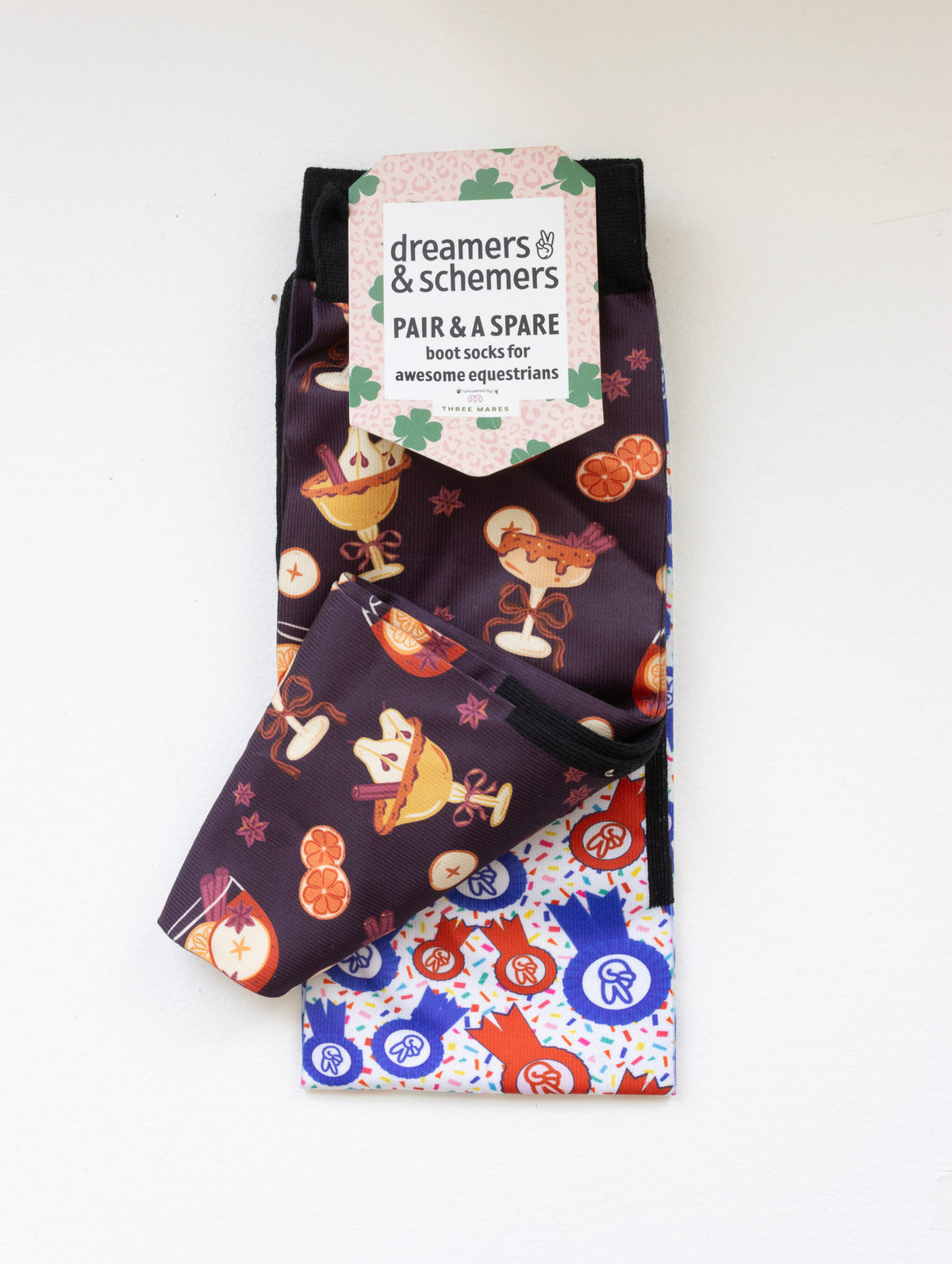 Stir Crazy boot socks shown folded with the included spare sock and printed cuff detail