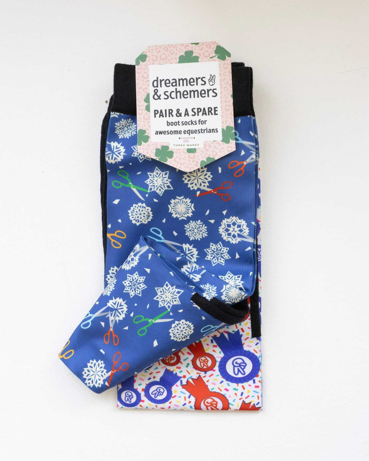 Shear Magic boot socks shown folded with the included spare sock and printed cuff detail
