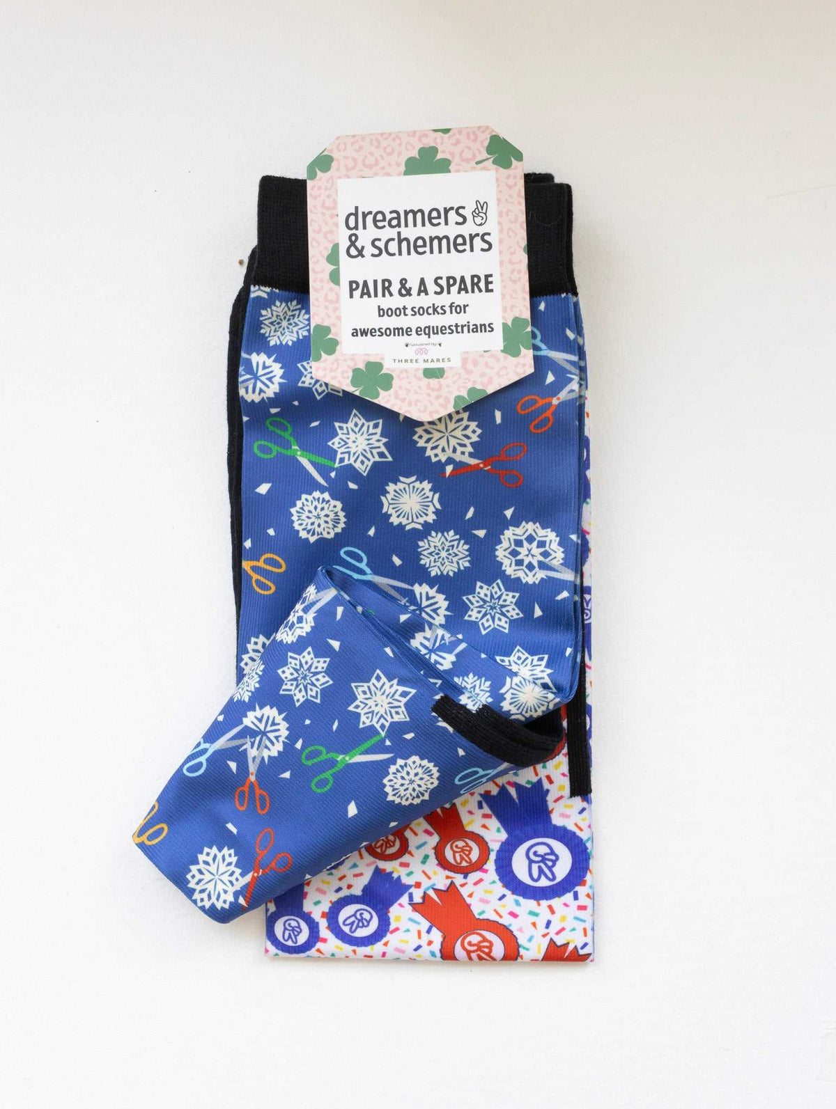 Shear Magic boot socks shown folded with the included spare sock and printed cuff detail
