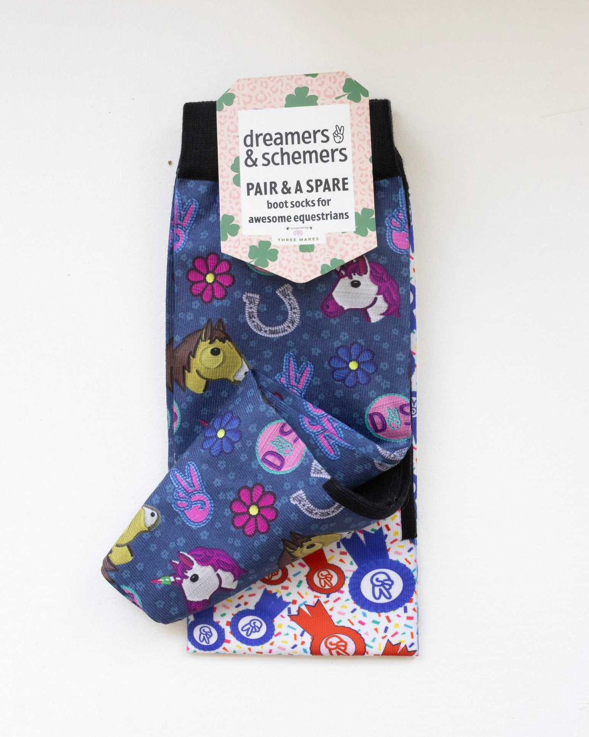 Patch Perfect boot socks shown folded with the included spare sock and printed cuff detail