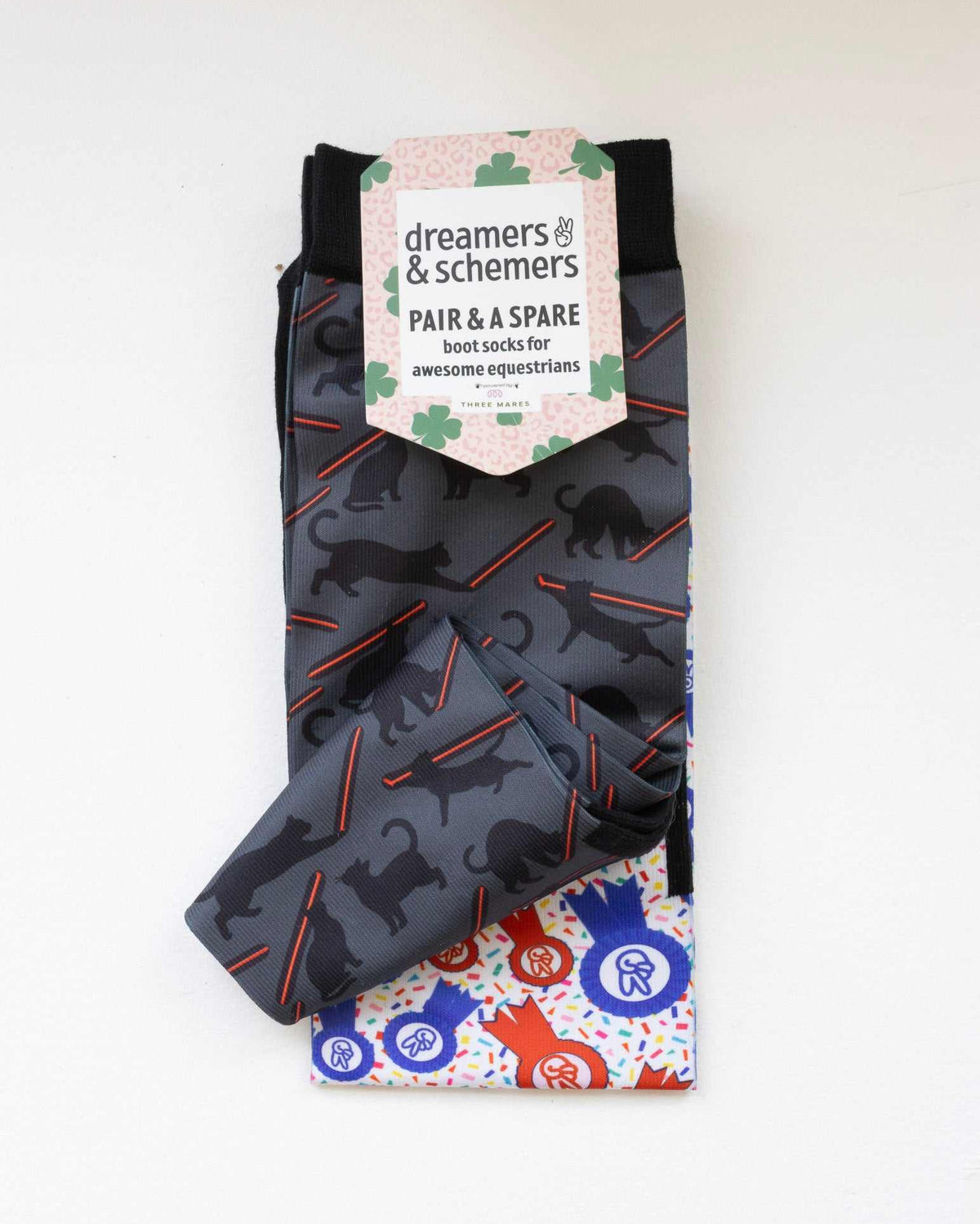 Laser Cats boot socks shown folded with the included spare sock and printed cuff detail