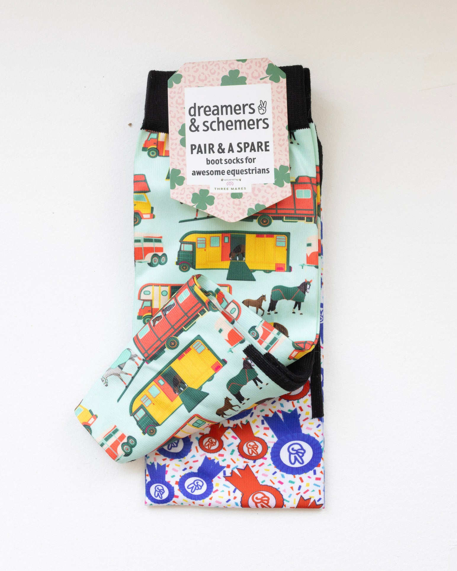 The Pony Island Retro Trailers boot socks shown folded with the included spare sock and printed cuff detail