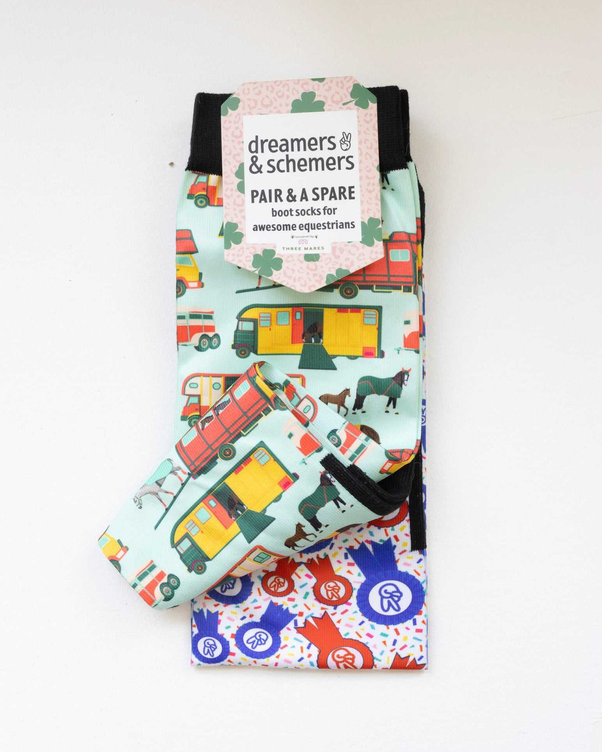 The Pony Island Retro Trailers boot socks shown folded with the included spare sock and printed cuff detail