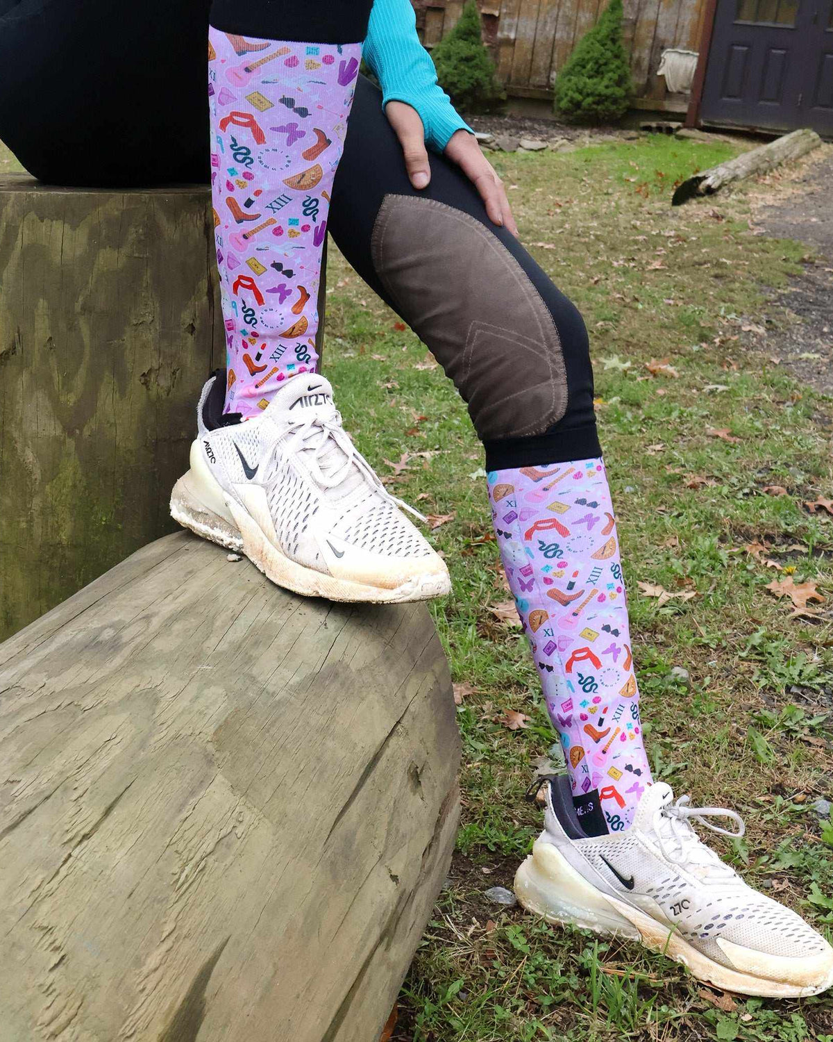 Colorful limited edition boot socks with music and shoe patterns worn outdoors
