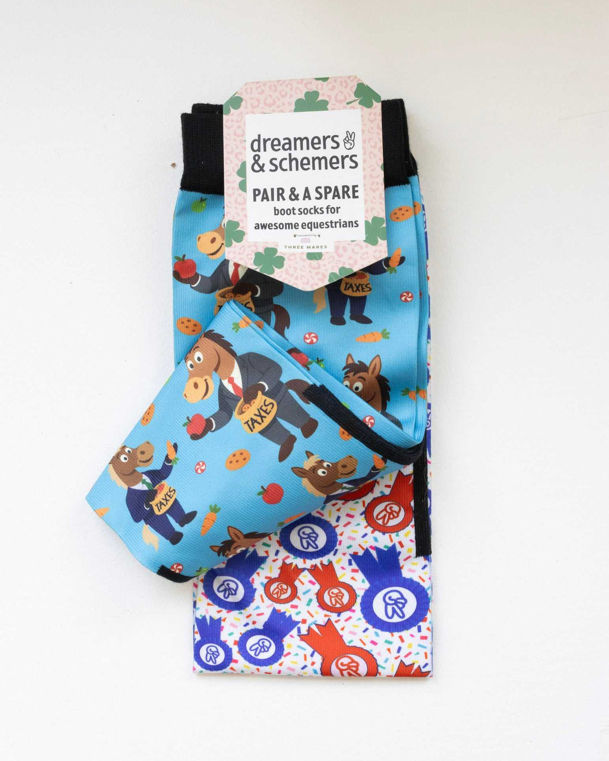 Treat Tax boot socks shown folded with the included spare sock and printed cuff detail