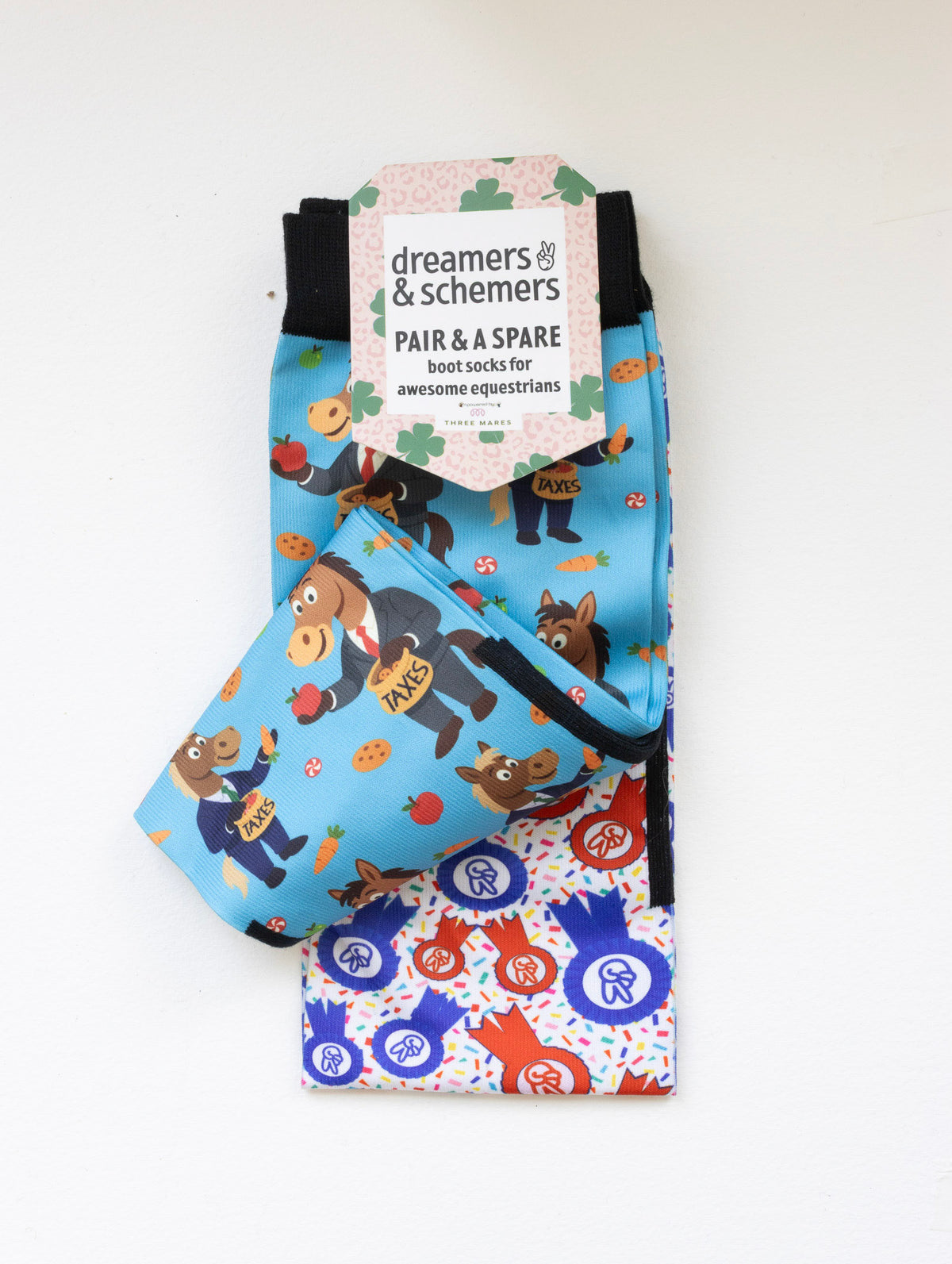 Treat Tax boot socks shown folded with the included spare sock and printed cuff detail