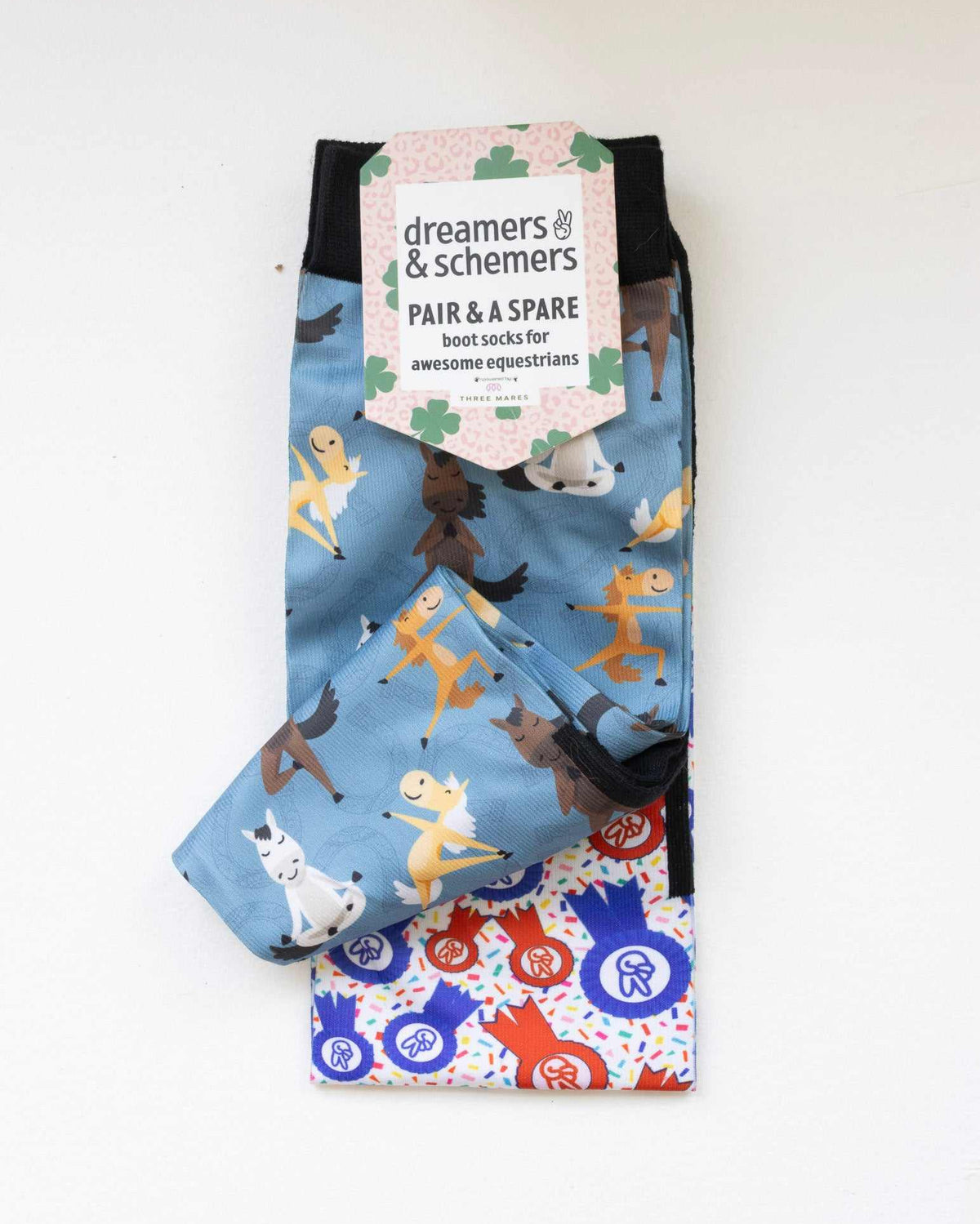 Pony Pilates boot socks shown folded with the included spare sock and printed cuff detail