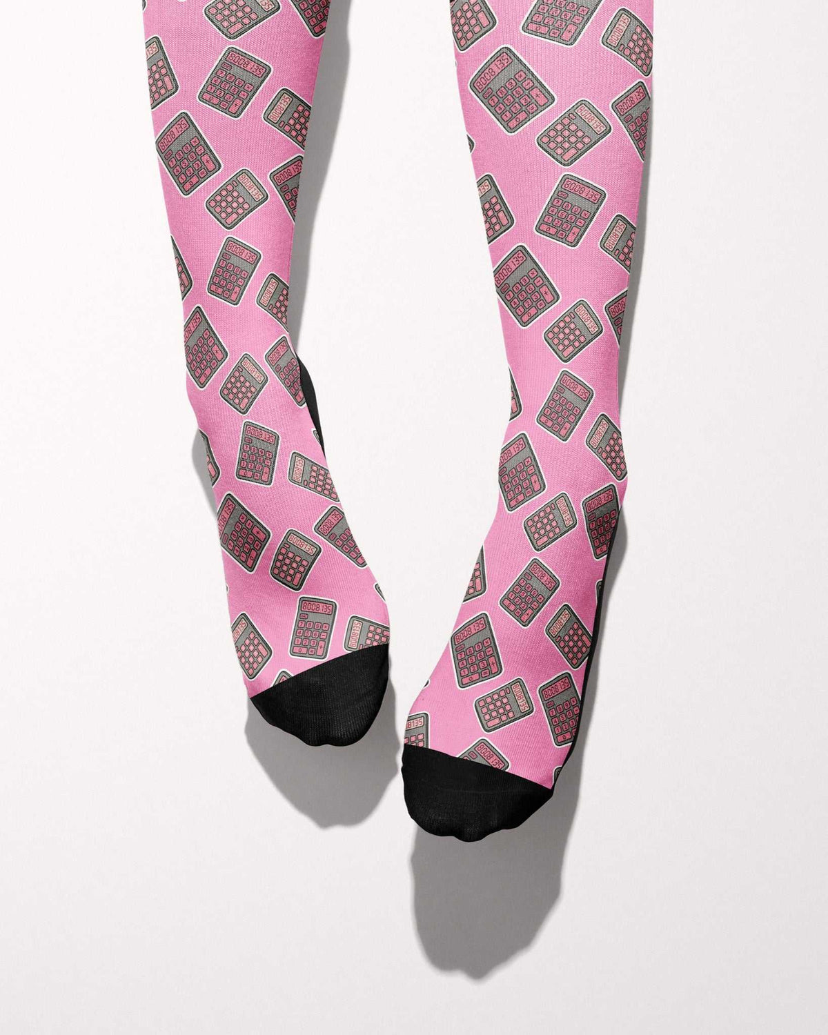 Boobies Limited Edition boot socks, calculator print on pink, worn, showing the full-length pattern, by Dreamers & Schemers