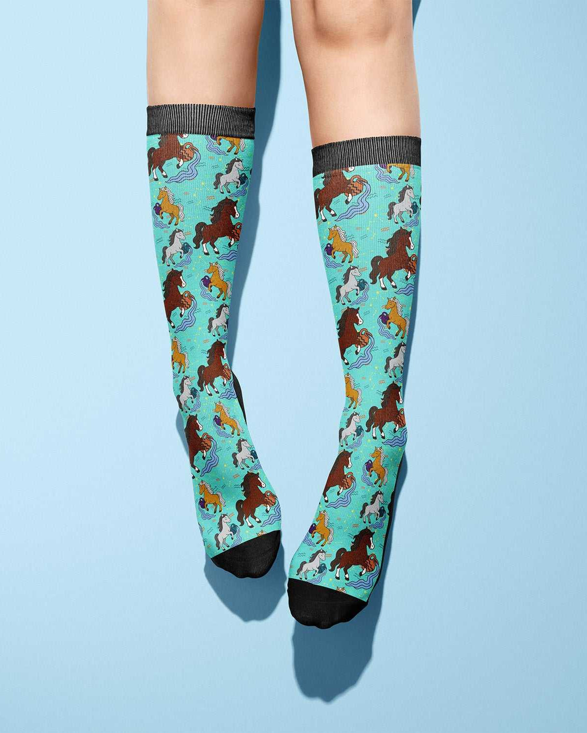 Aquarius-themed limited edition boot socks with colorful horse pattern on turquoise background