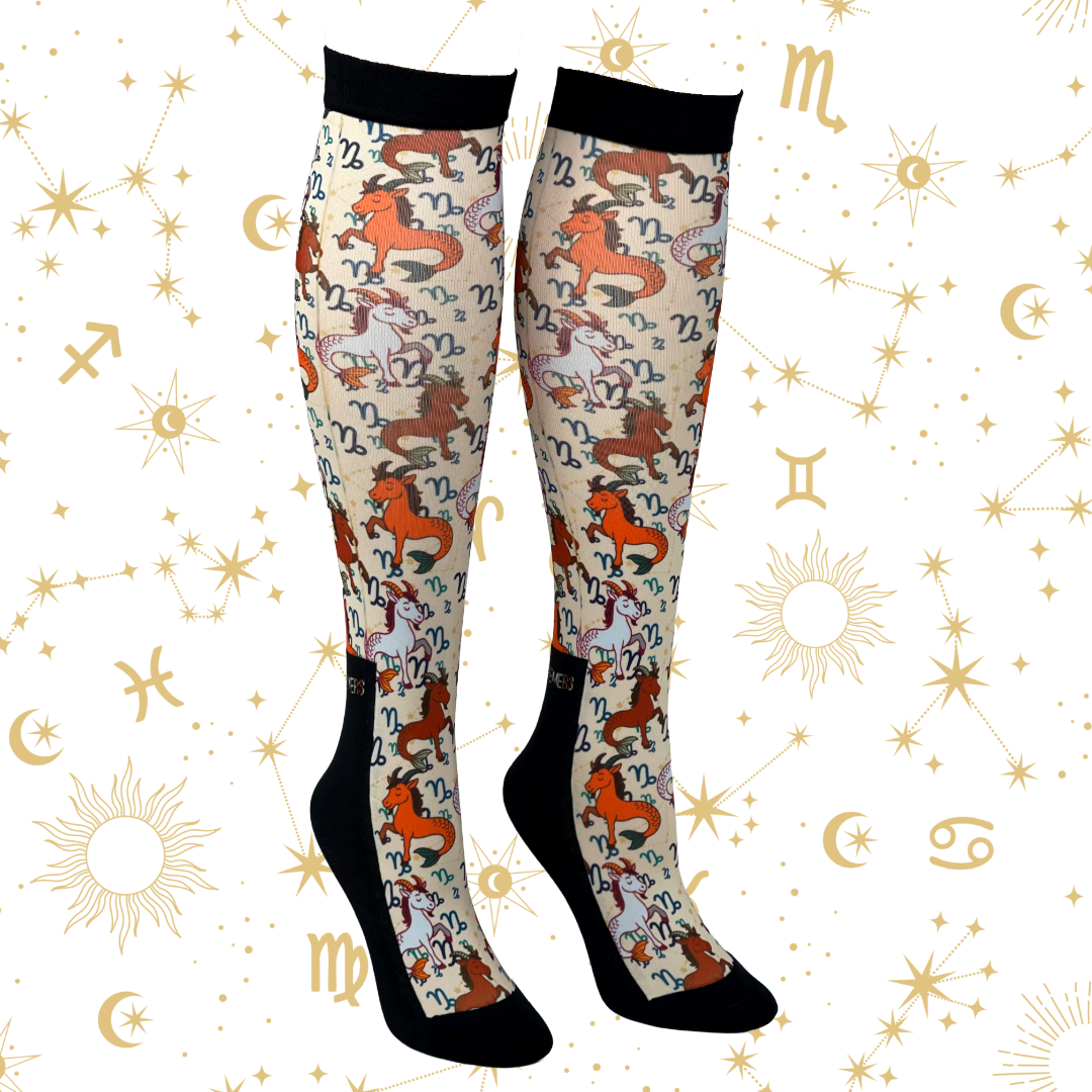 Capricorn zodiac design boot socks in black, brown, and beige colors with astrological symbols, made in the USA.