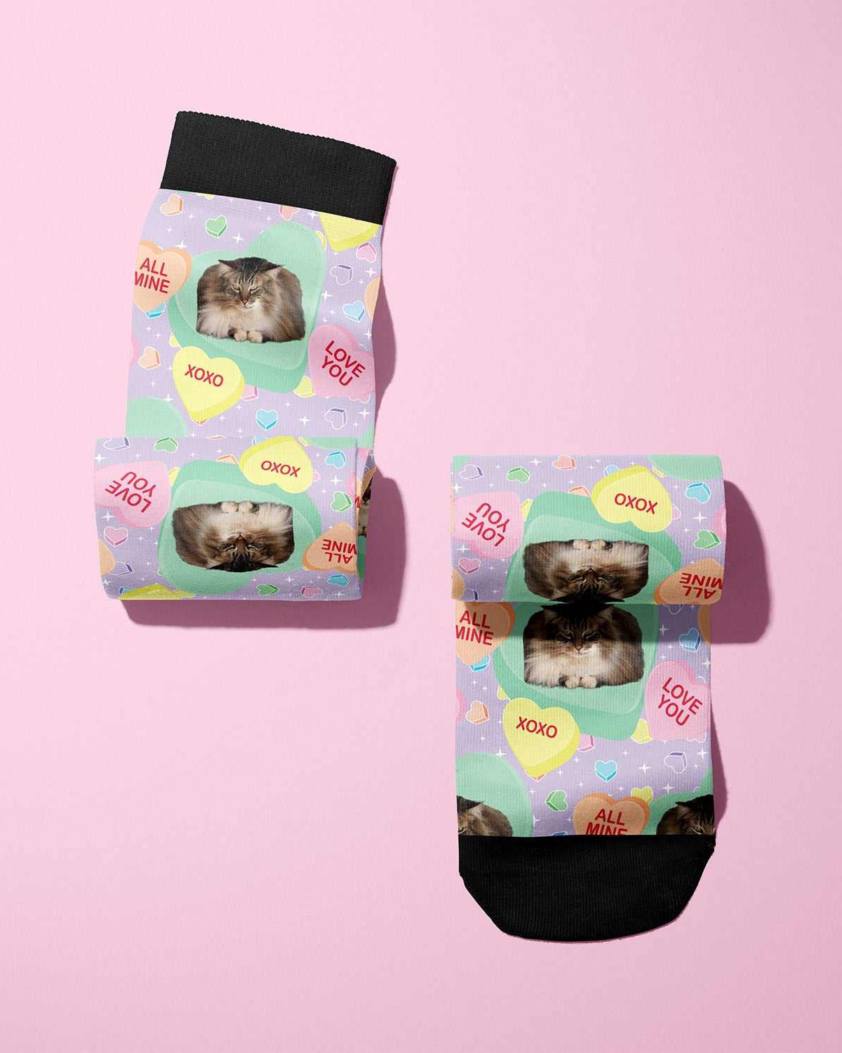 Custom boot socks with candy heart pattern and personalized cat photo design on pastel background