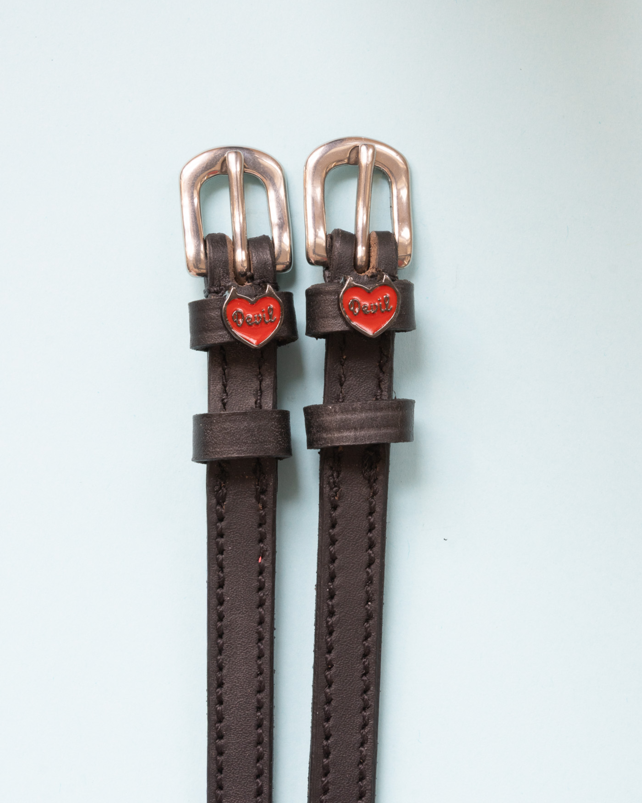 Dark brown leather Devil heart spur straps with rose gold buckles on pale mint