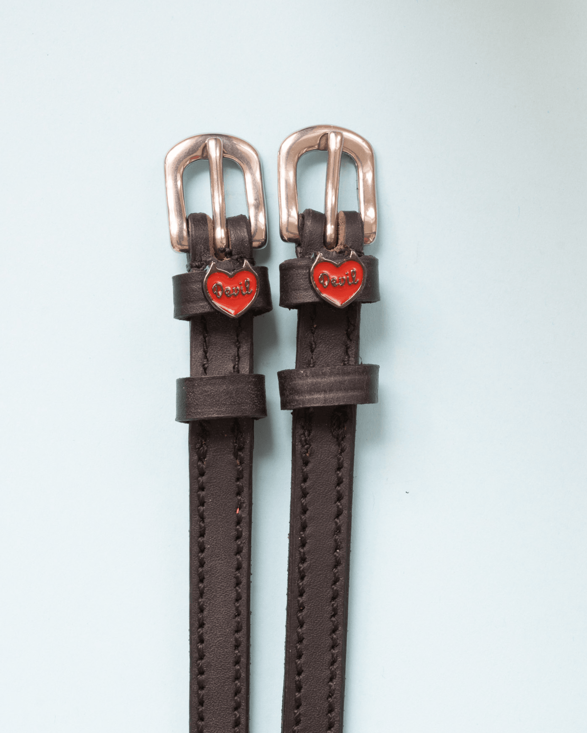 Dark brown leather Devil heart spur straps with rose gold buckles on pale mint