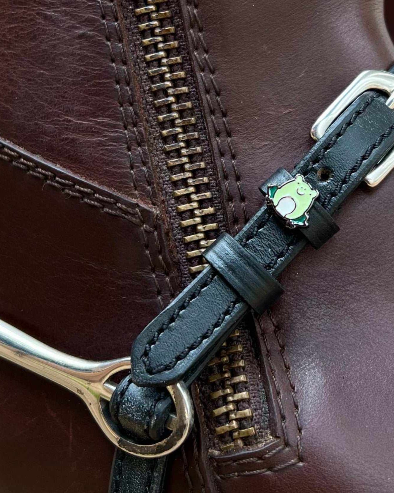 ManeJane frog spur strap fastened on a brown zip-up riding boot with a silver spur