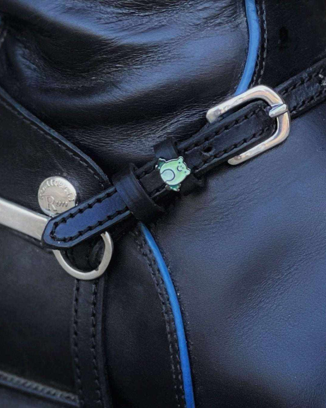 ManeJane frog spur strap fastened on a black English riding boot with a silver spur
