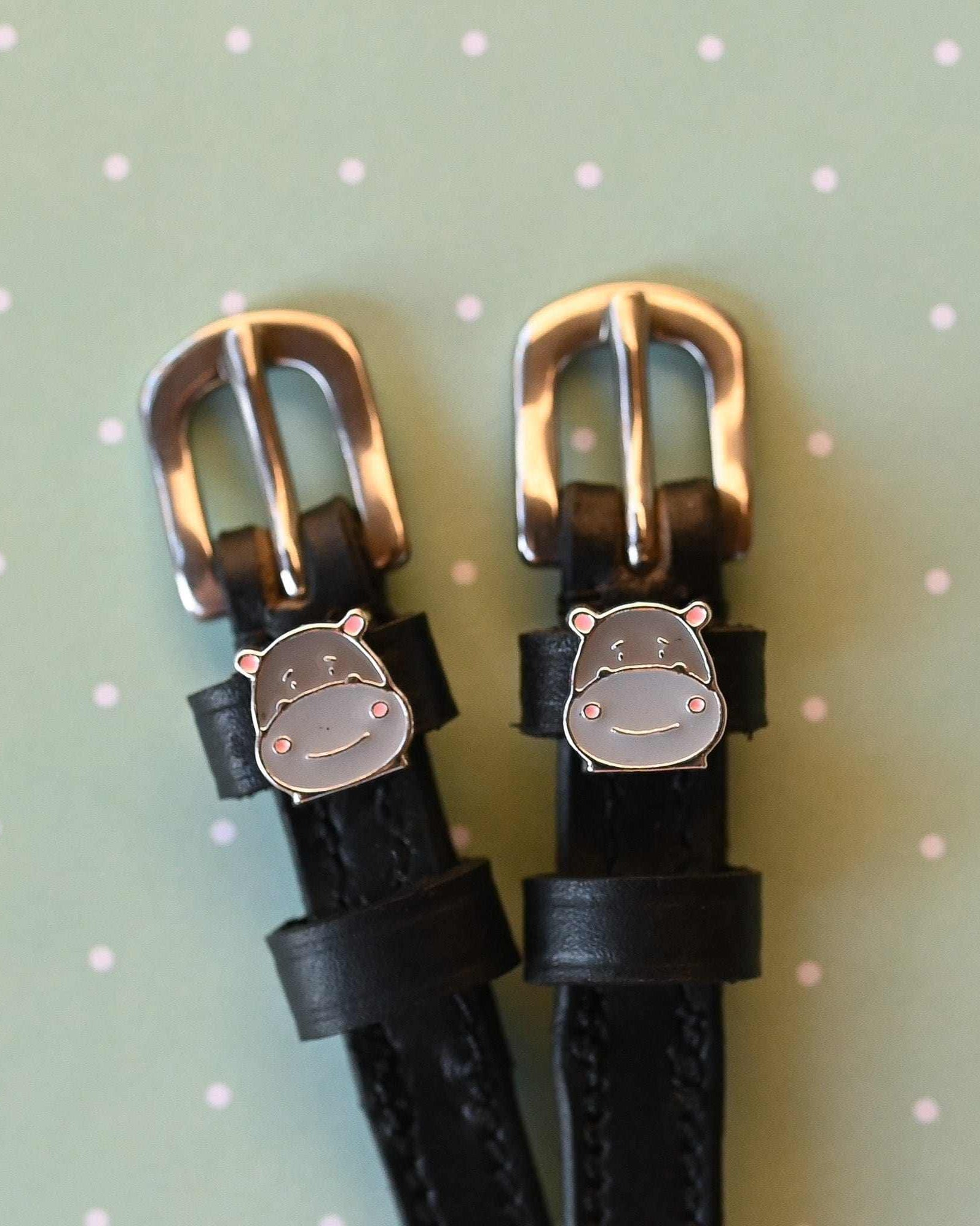 Hippo Face spur straps with rose gold buckles and hippo charms on sage green polka dots