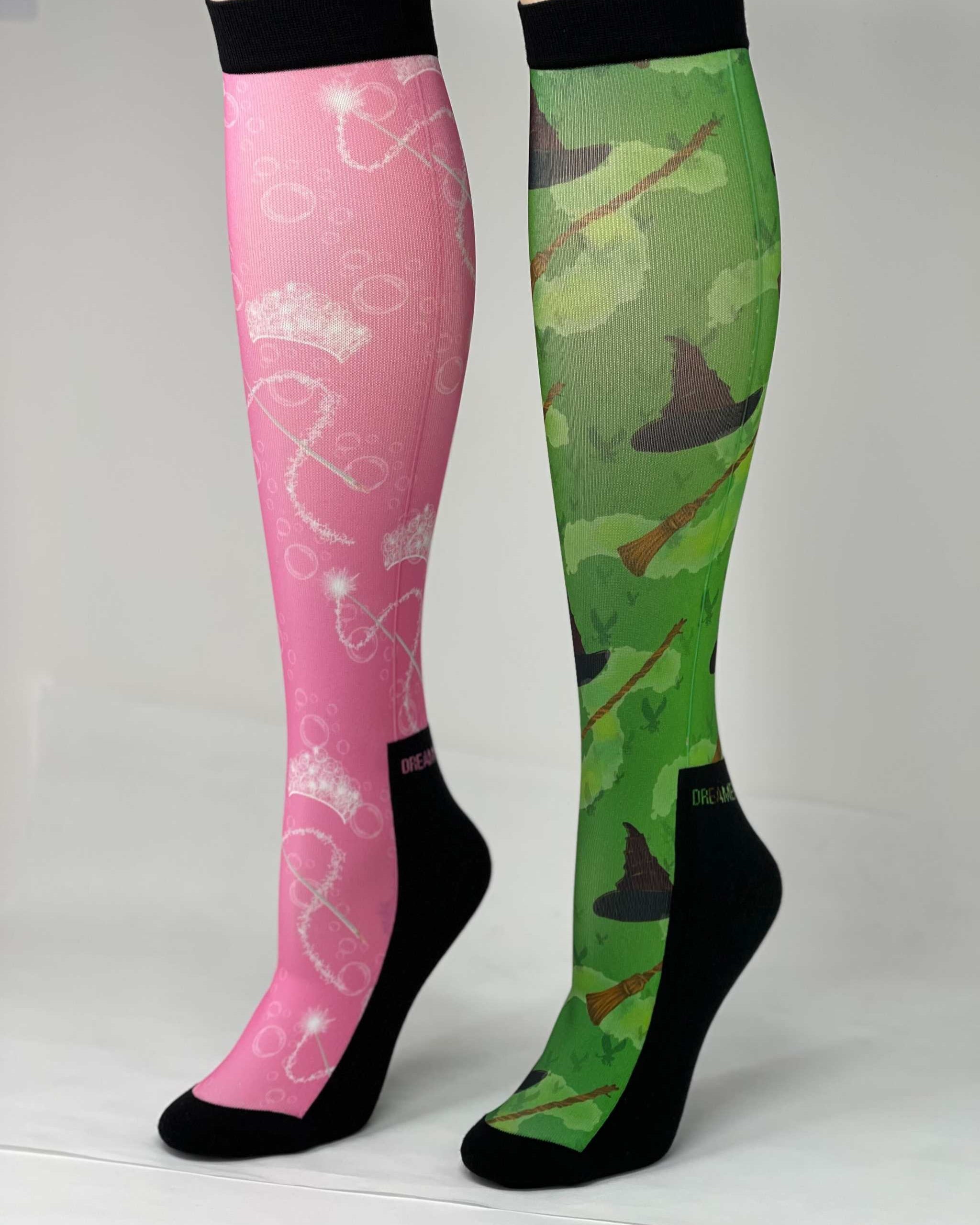 Pair of limited edition wicked boot socks in pink and green with unique magical designs