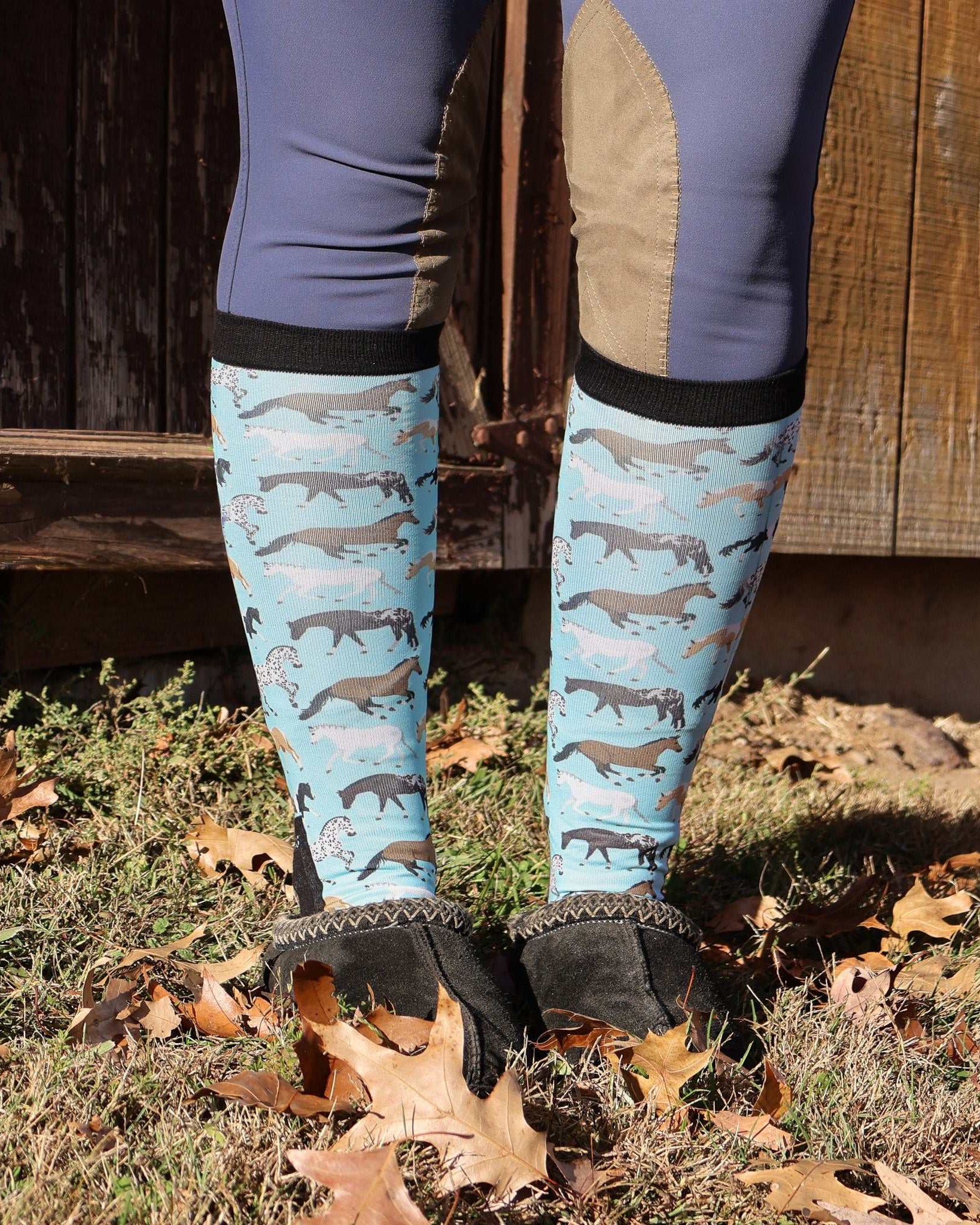 Limited Edition Pony Island Aqua Ponies teal boot socks with playful horse design worn outdoors