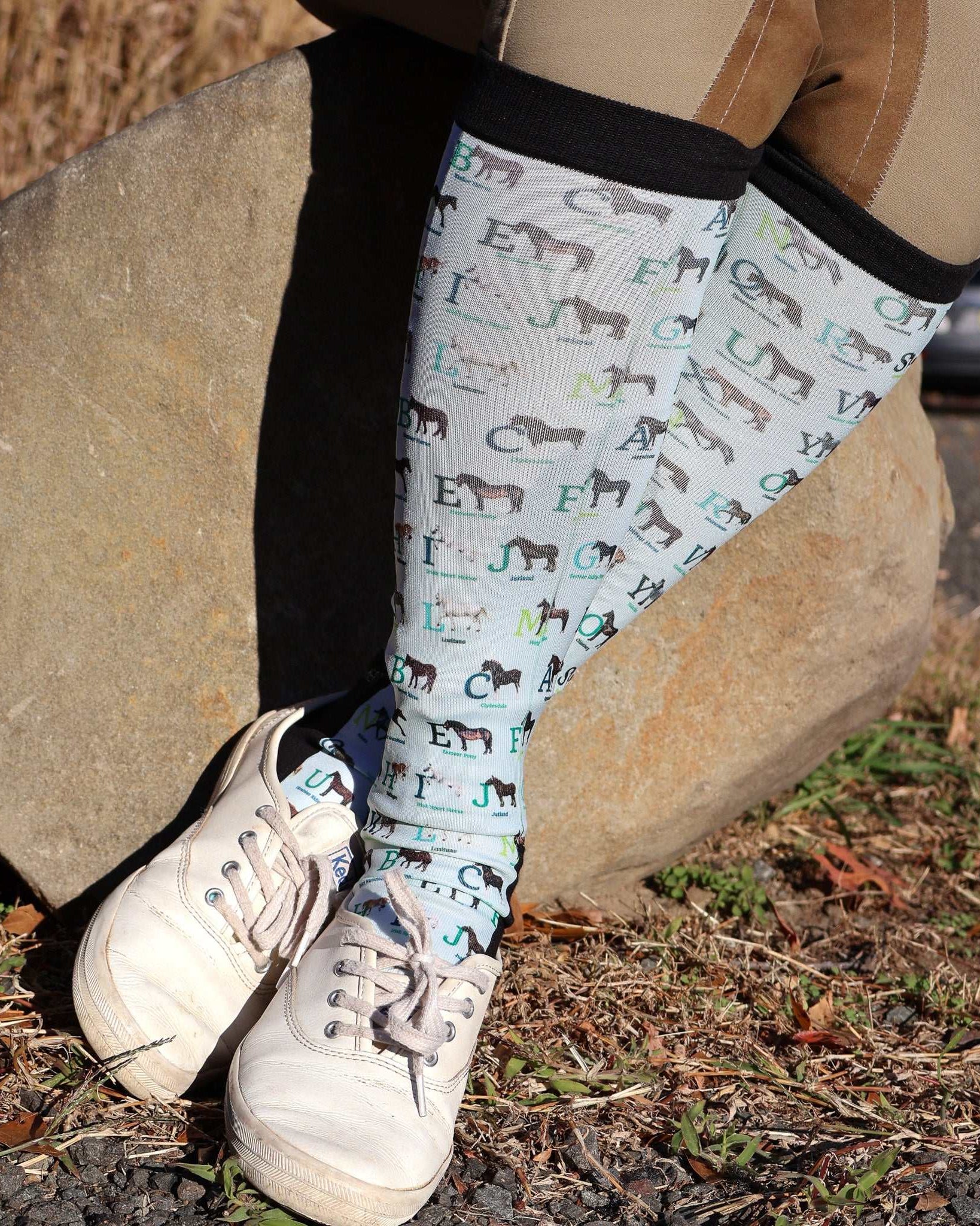 Limited Edition Pony Island Alphabet Horses socks featuring colorful pony and alphabet design worn outdoors