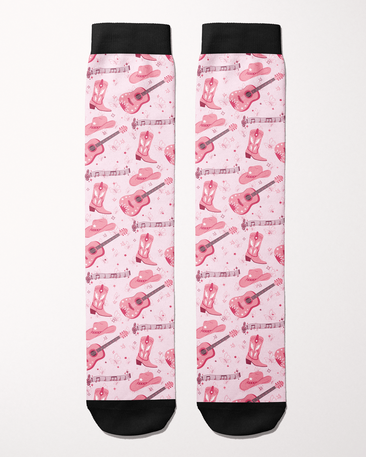 Dolly Forever socks in light pink, full pattern of cowgirl boots, guitars, hats and music notes
