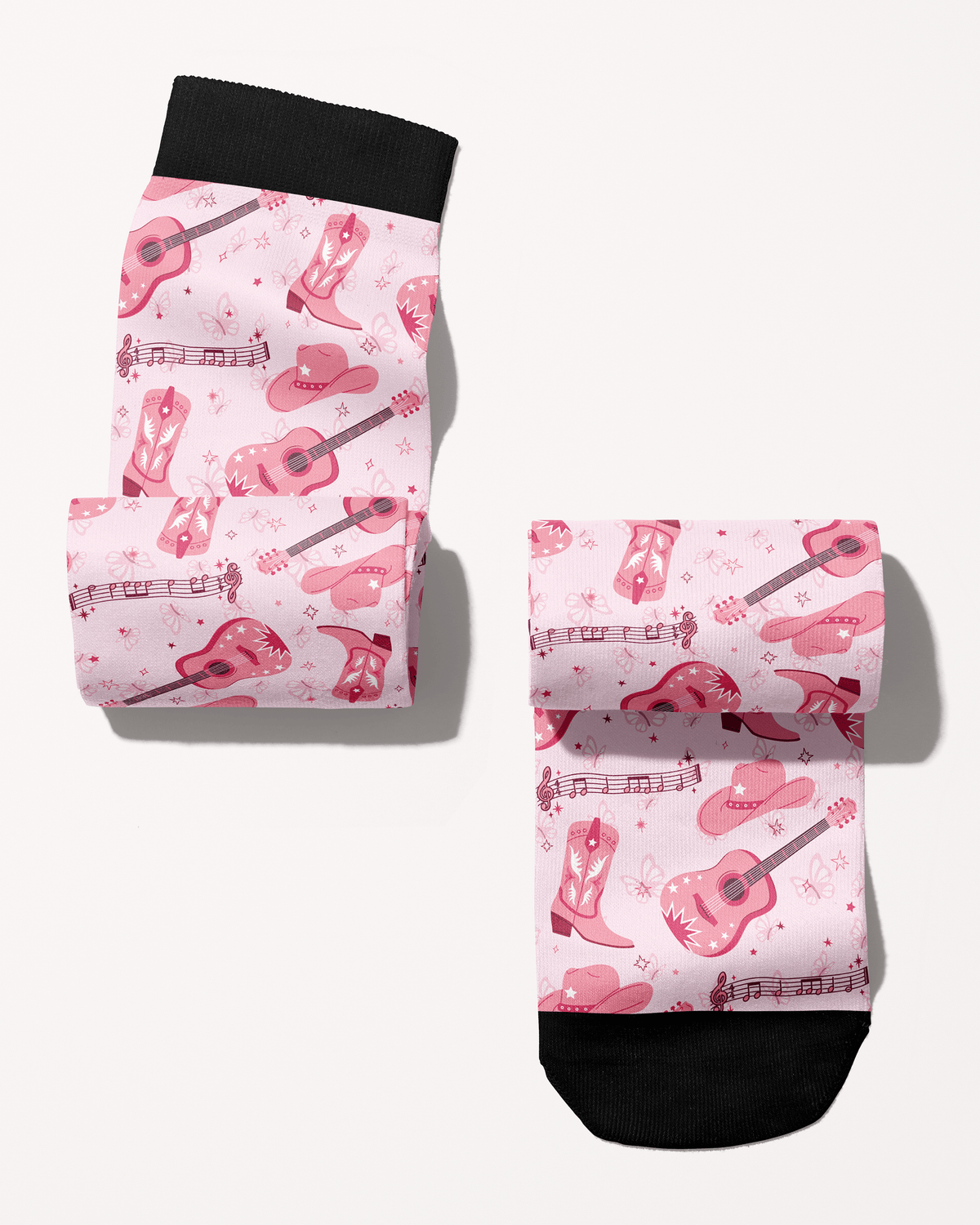Dolly Forever boot socks rolled into a pair, pink cowgirl boots, guitars and hats print