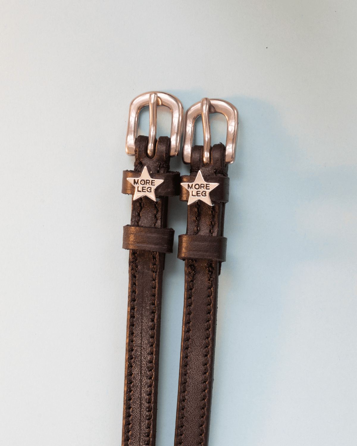 Dark brown leather MORE LEG star spur straps with rose gold buckles on mint