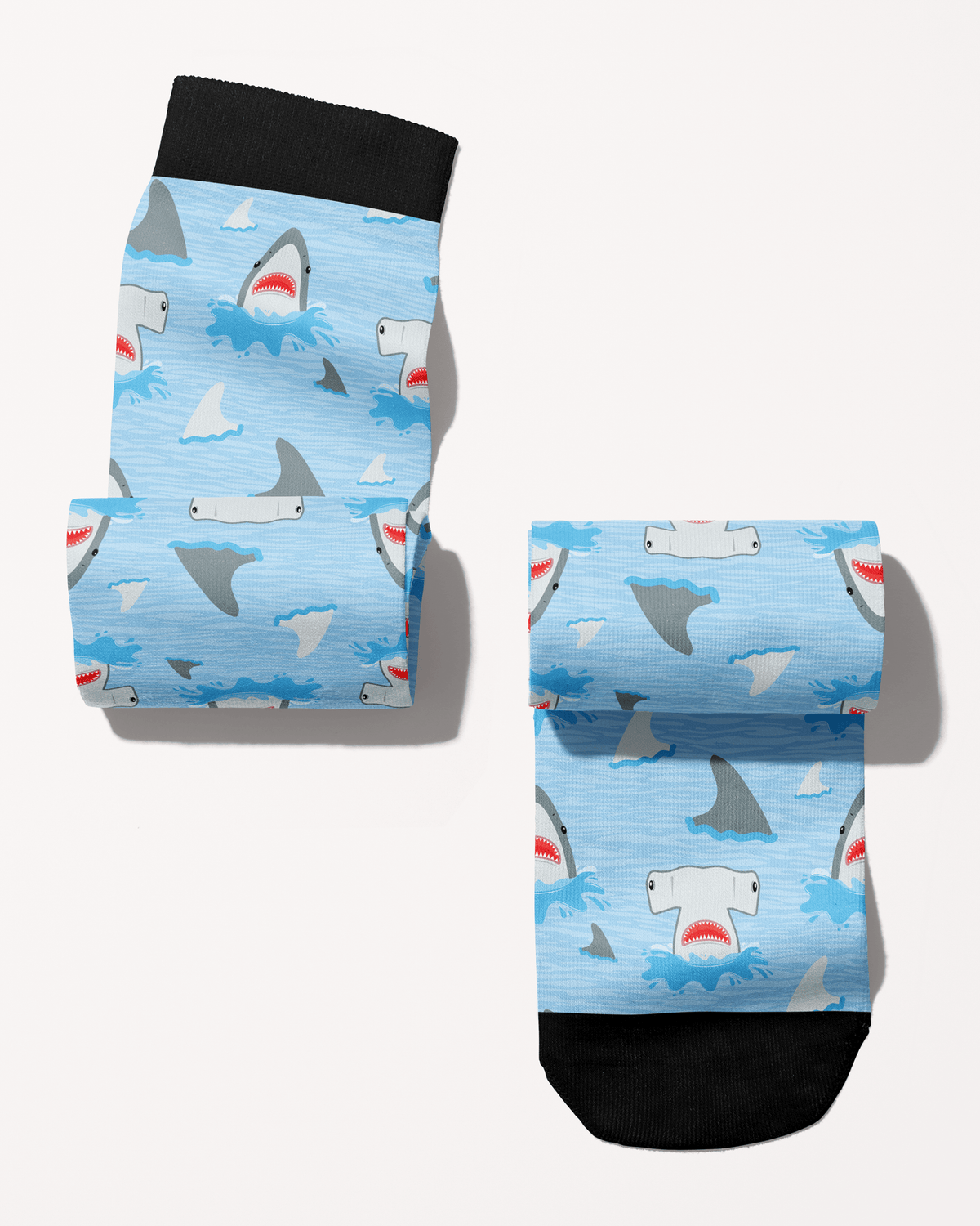 Shark Week boot socks in blue, alternate view showing the black cuff, toe and cartoon shark print