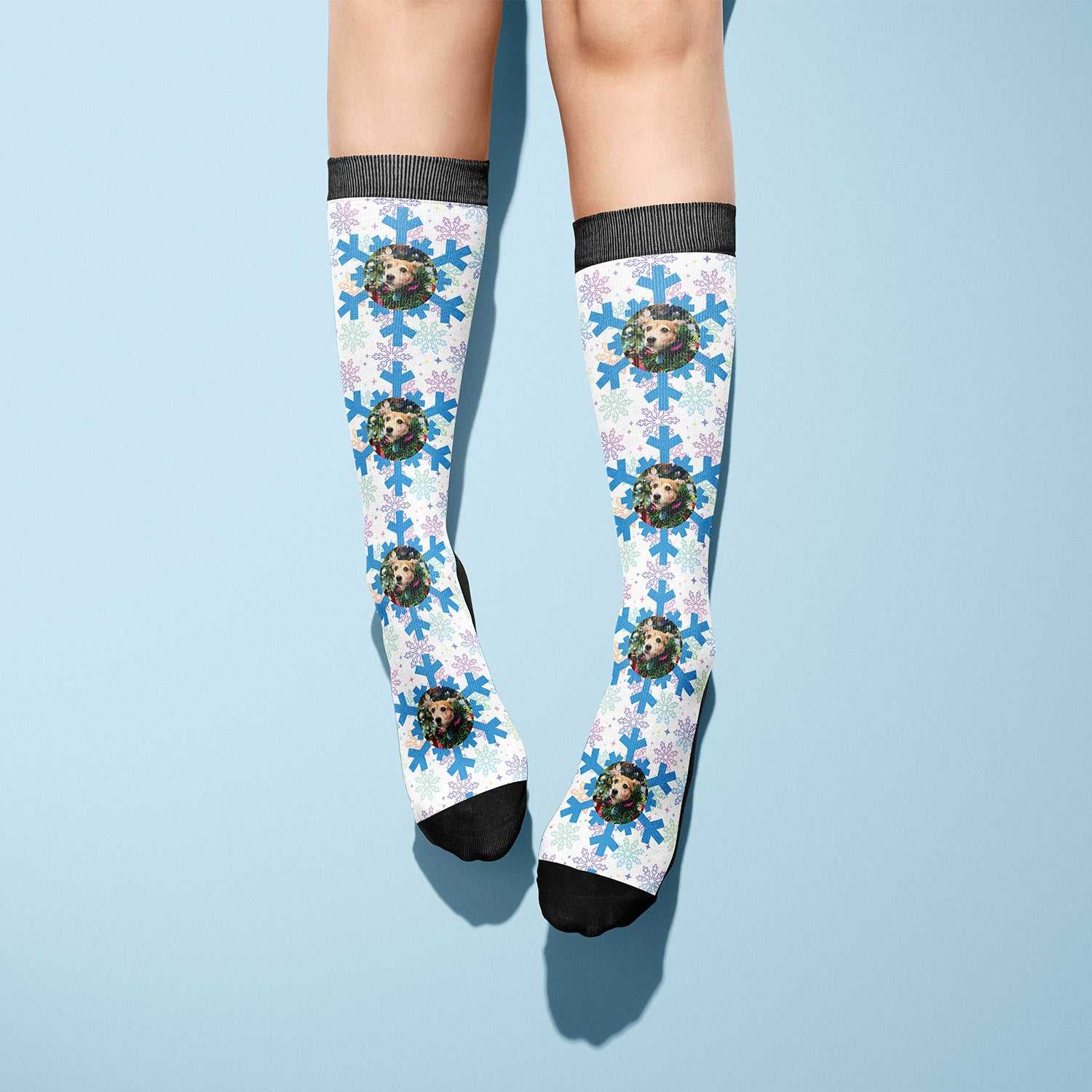 custom socks with blue snowflake pattern and personalized images on white background