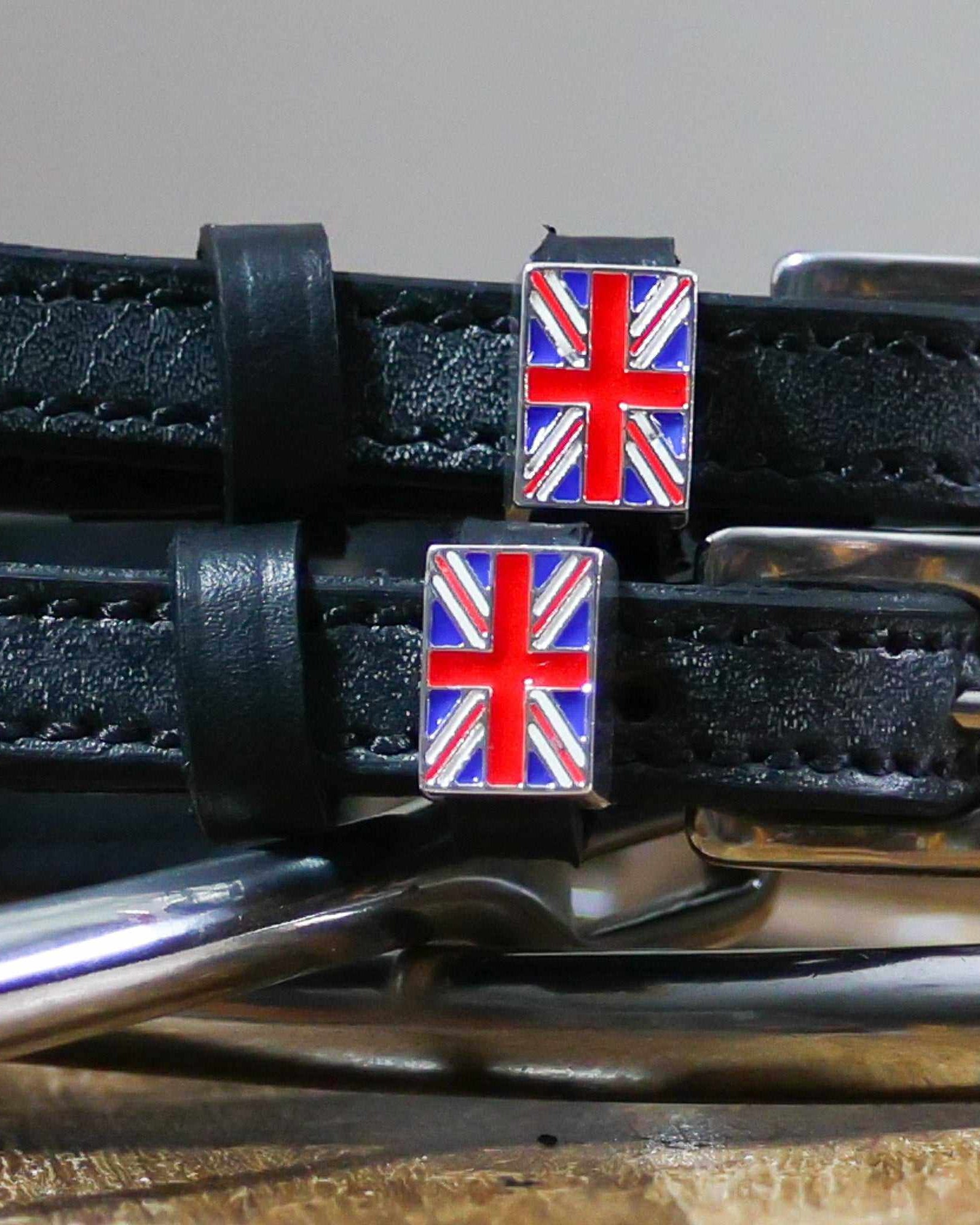 Close-up of enamel Union Jack flag charms on black leather spur strap keepers