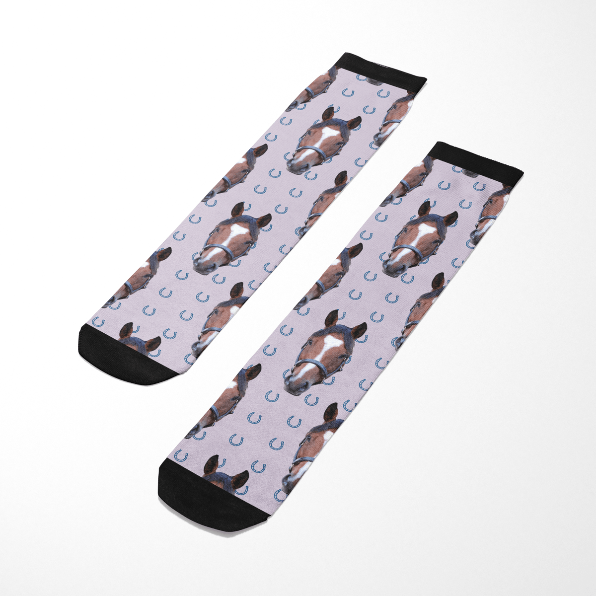Custom Solo socks with blue horseshoes and horse head pattern on light background