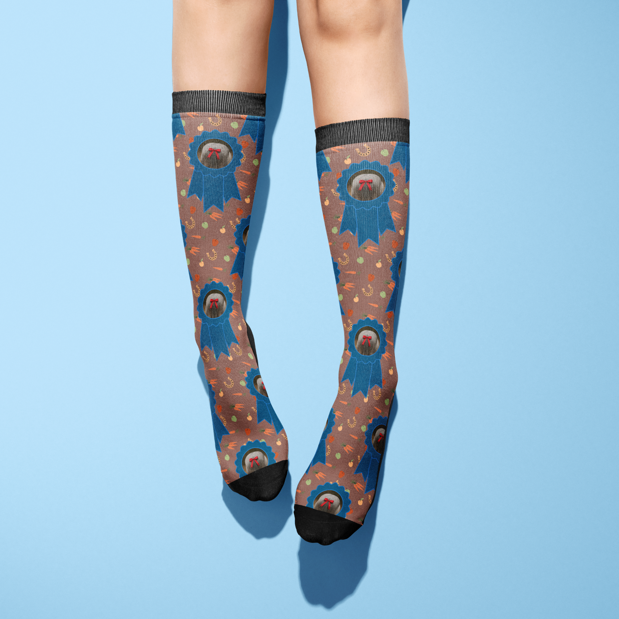 Custom blue ribbon pattern knee-high socks worn on legs against blue background
