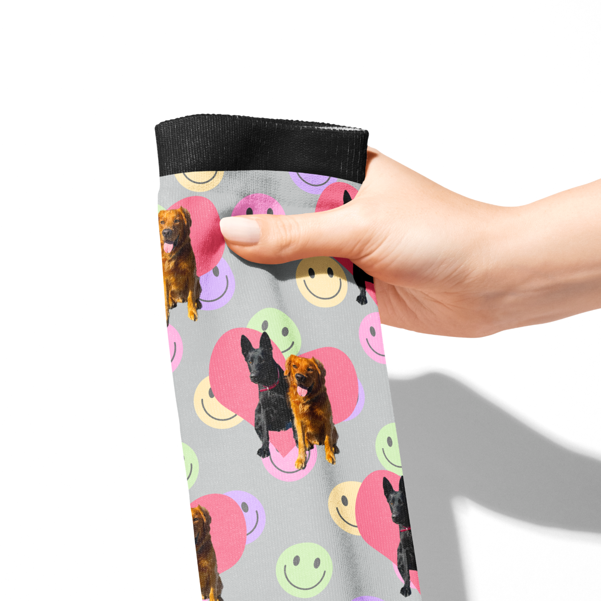 Hand holding custom Heart with Smiley Vibes Socks featuring dog photos and colorful smiley faces pattern