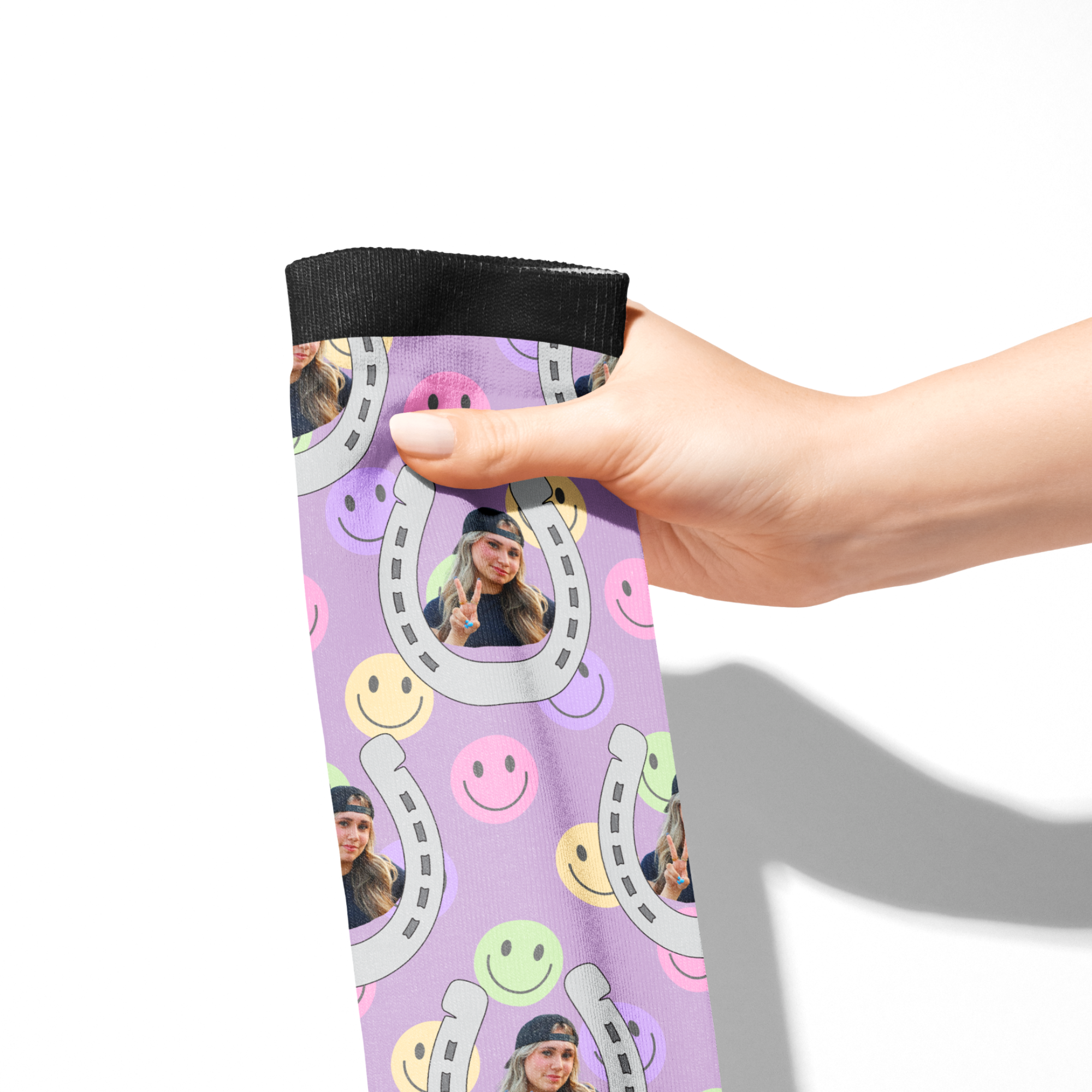Hand holding a Custom Horseshoe smiley face purple sock with a personalized photo print